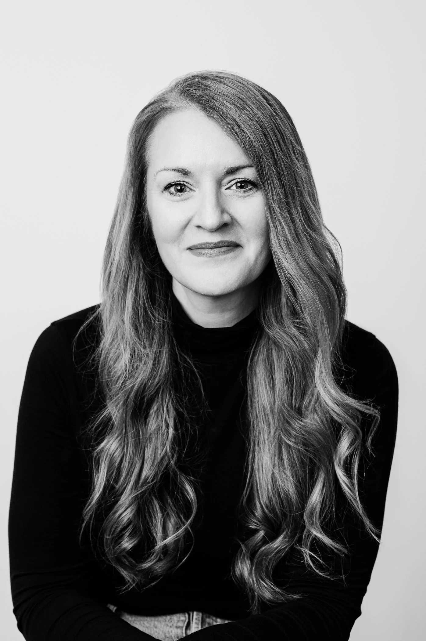 Black and white portrait of a female CEO.