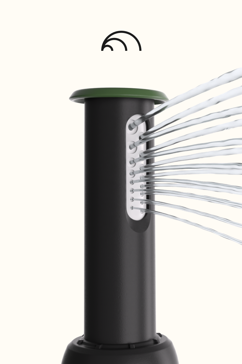 Close-up of a black cylindrical wireless charging station with multiple silver charging cables and a wireless signal icon.
