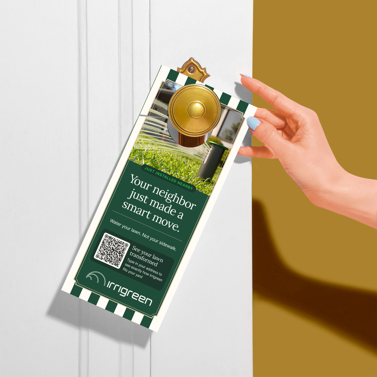 Hand placing an Irrigreen smart lawn sprinkler advertisement on a front door, featuring a QR code and grass watering imagery.
