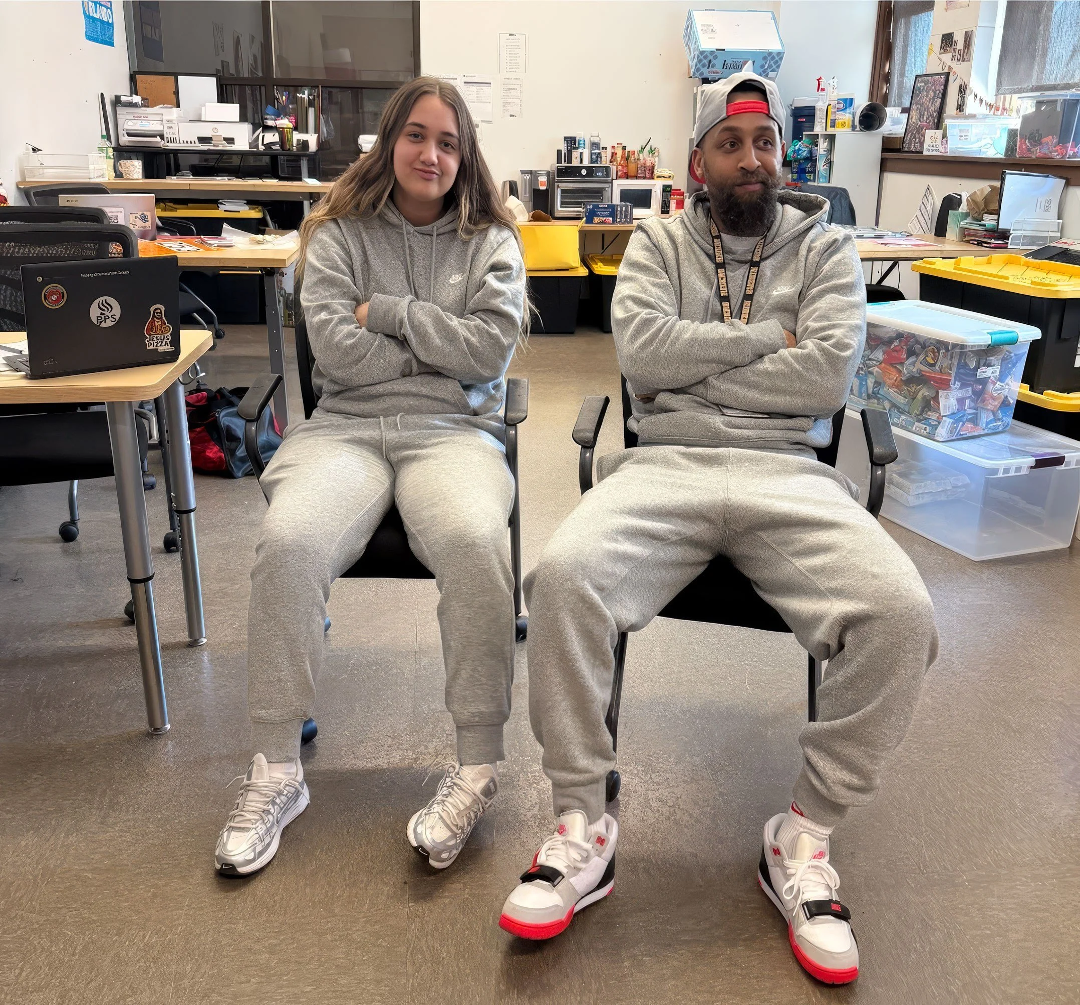 A Step Up student and their Advocate sitting side by side in a school classroom