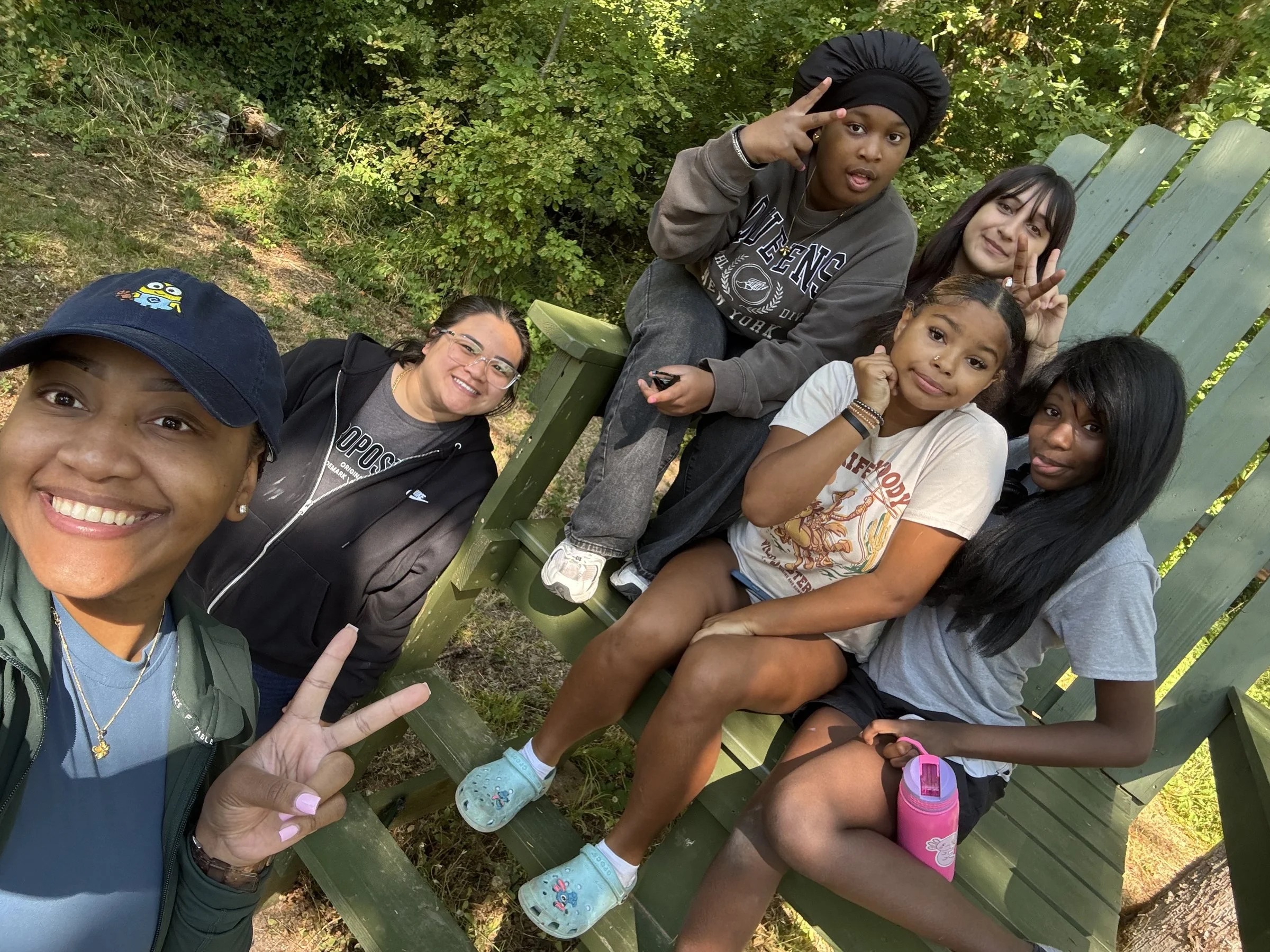Step Up students relaxing in Adirondack chairs during Pre-Freshman Leadership Camp