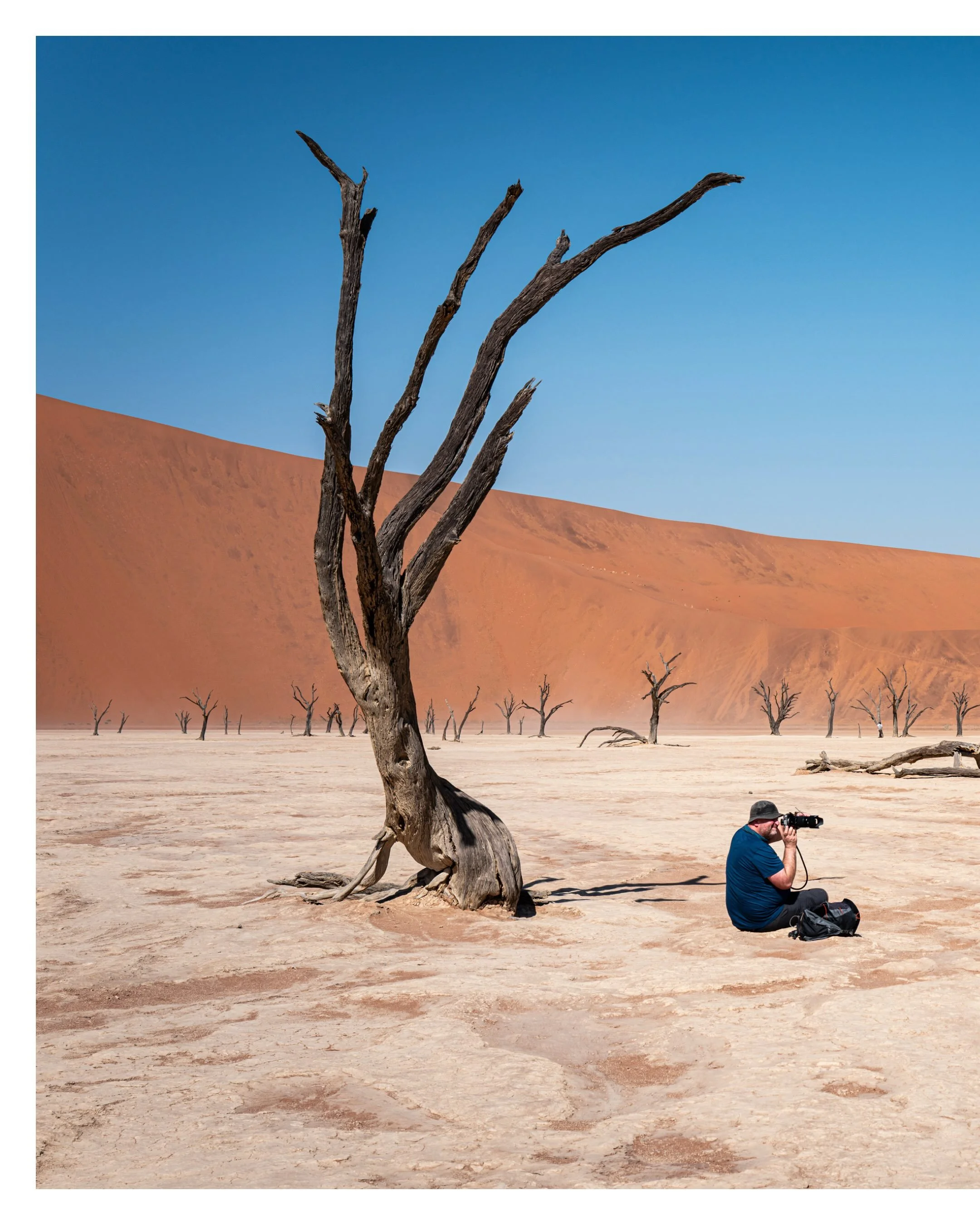 Me, taking a series from Deadvlei, Namibia &mdash; where ancient trees, white clay and towering red dunes form a landscape that feels almost unreal.

Silent, harsh and timeless.

#Deadvlei #Namibia #FineArtPhotography #LandscapePhotography #NamibDese