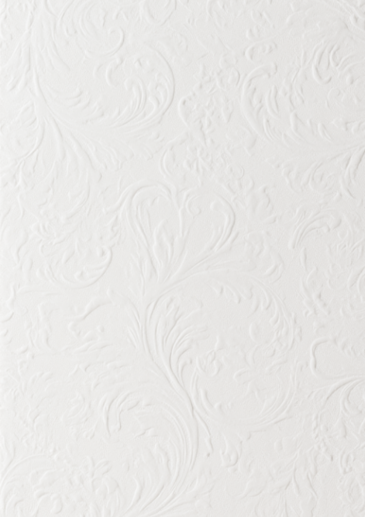 White textured wall with an embossed floral pattern.