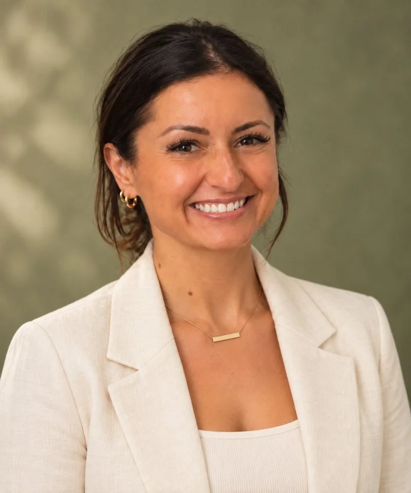 Headshot of Ashley Lambert, RDN, smiling in a cream blazer