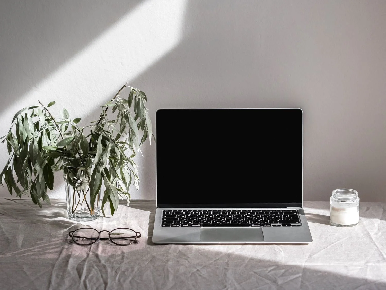 Laptop on a sunlit desk, set up for a virtual appointment with an online dietitian