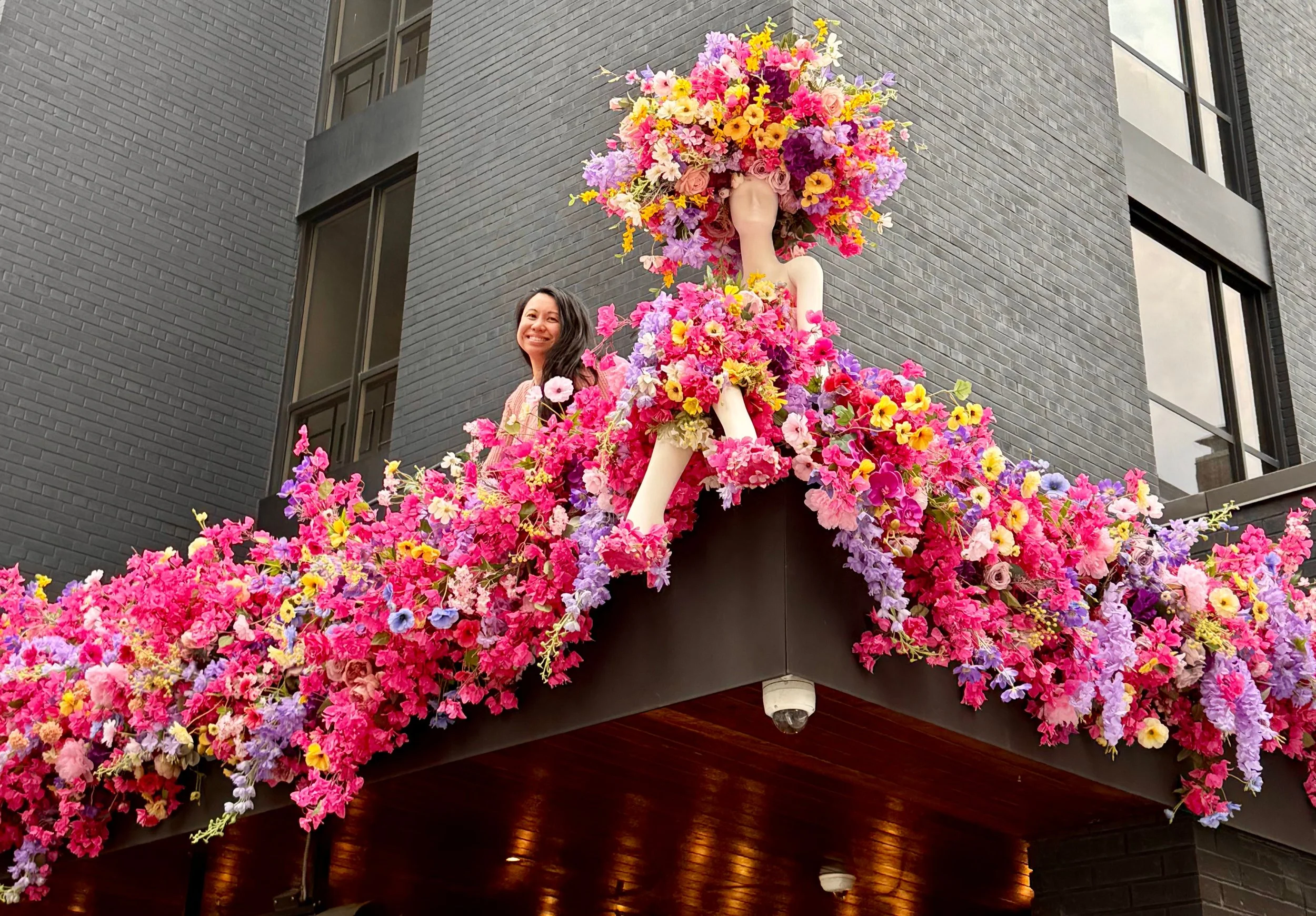 Canadian Floral Designer Artist Jeanna Jane Chua pictured with her spring floral mannequin on Annedore House rooftop for Fleur de Villes Spring Floral 2026 Bloor Yorkville Public installation