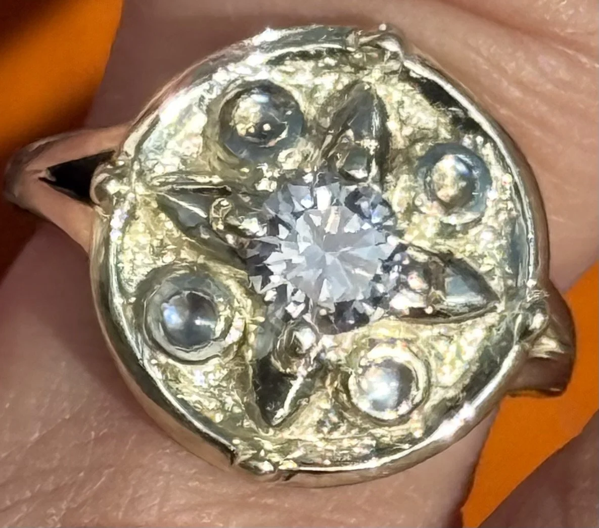 All four images show a rose gold engagement ring with a large rectangular center diamond, viewed from different angles against a neutral background.