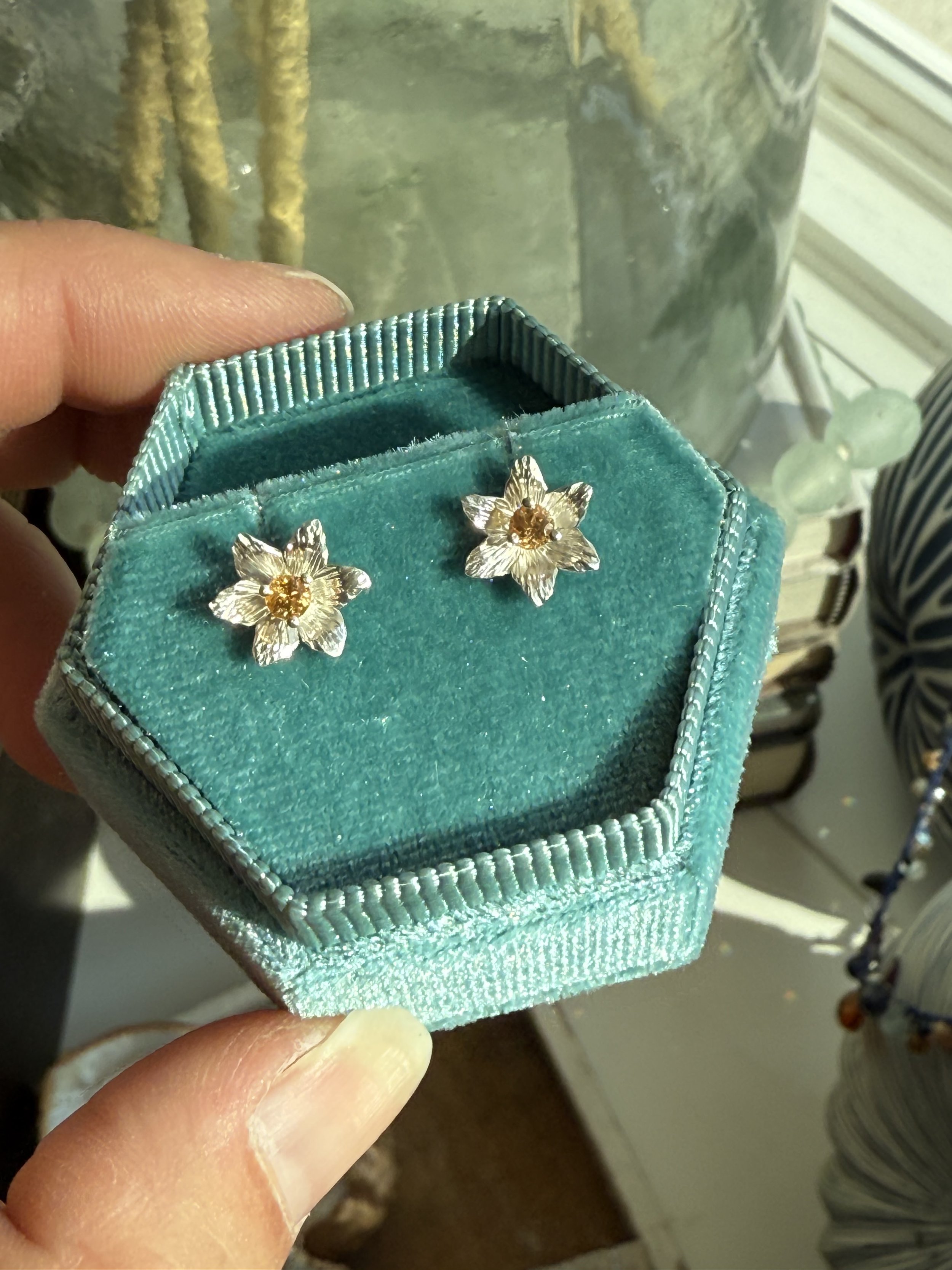 Sterling silver earrings set with mandarin garnets from our Fleur line, made to order with your choice of diamond or gemstone.