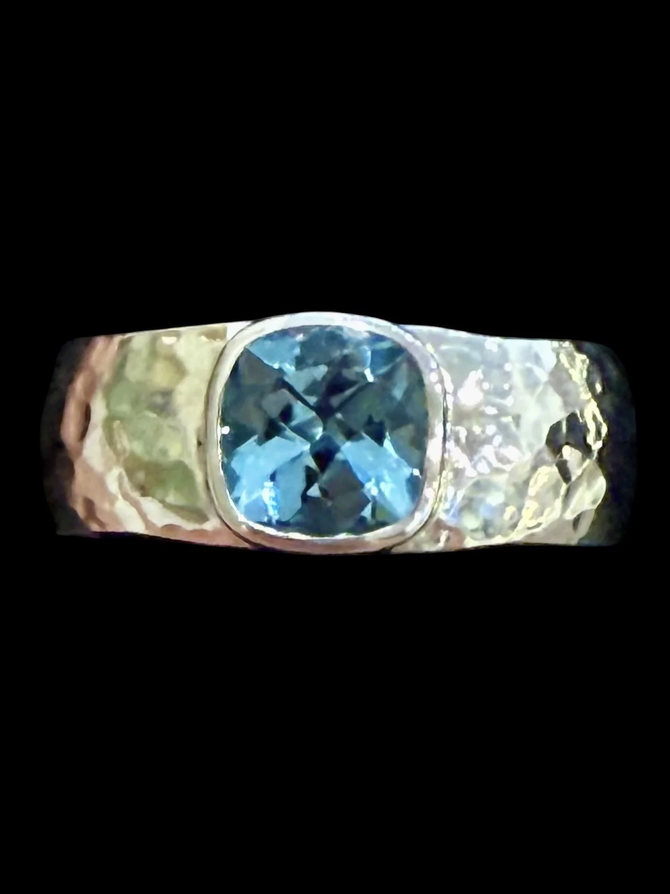 Custom engagement ring in 14K white gold with a cushion cut aquamarine of over 1 carat.