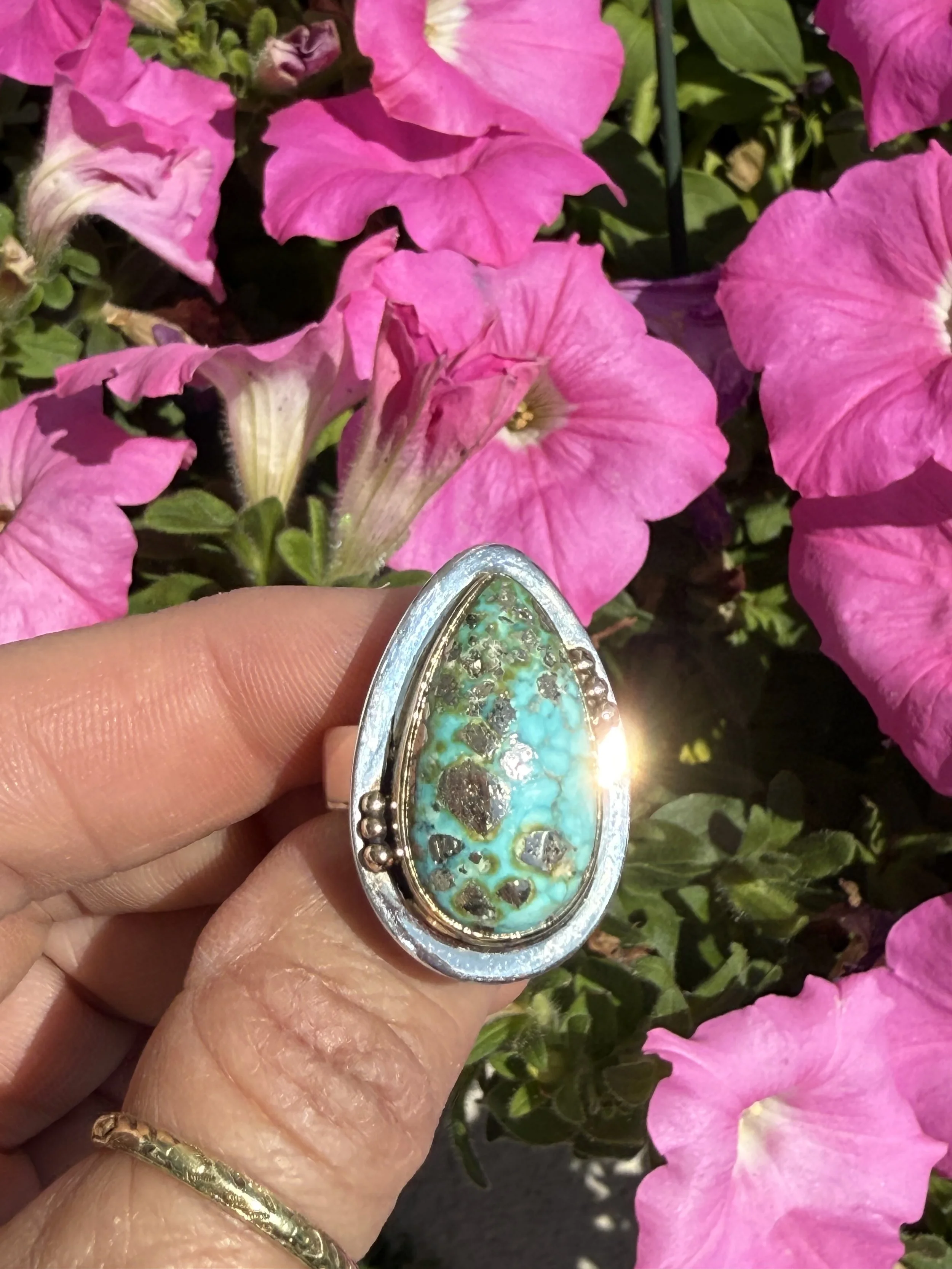 Sonoran turquoise ring in sterling silver with a 14K gold bezel and beaded accents.