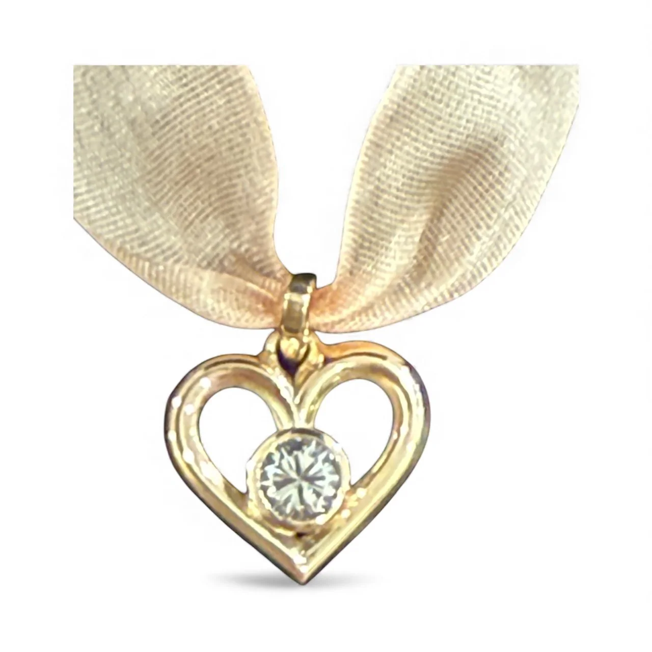 14K gold heart-shaped pendant using customer's gold materials and diamond.
