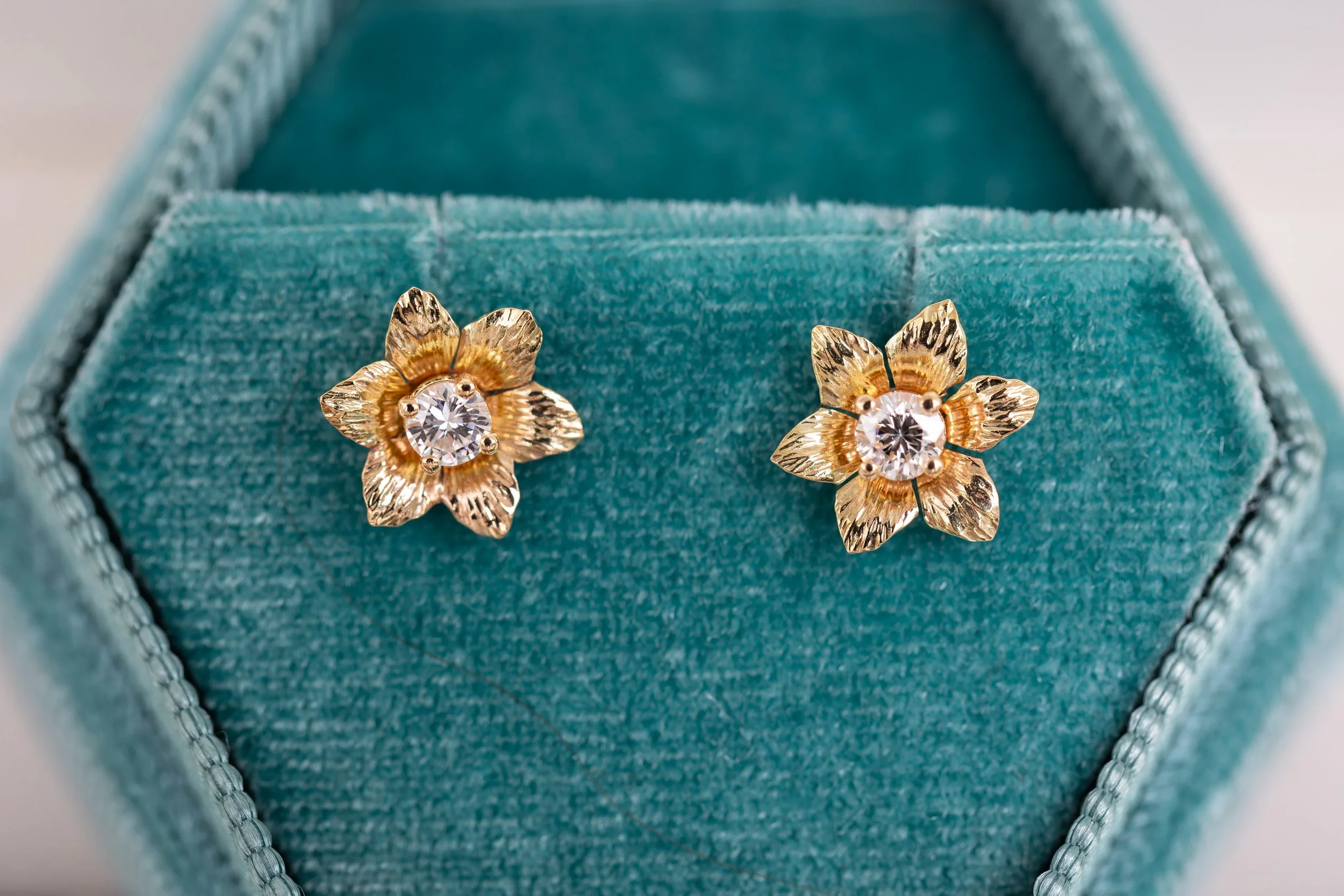 14K gold flower earrings set with diamonds from our Fleur line, made to order with your choice of diamond or gemstone. These are each individualyy handcrafted. 