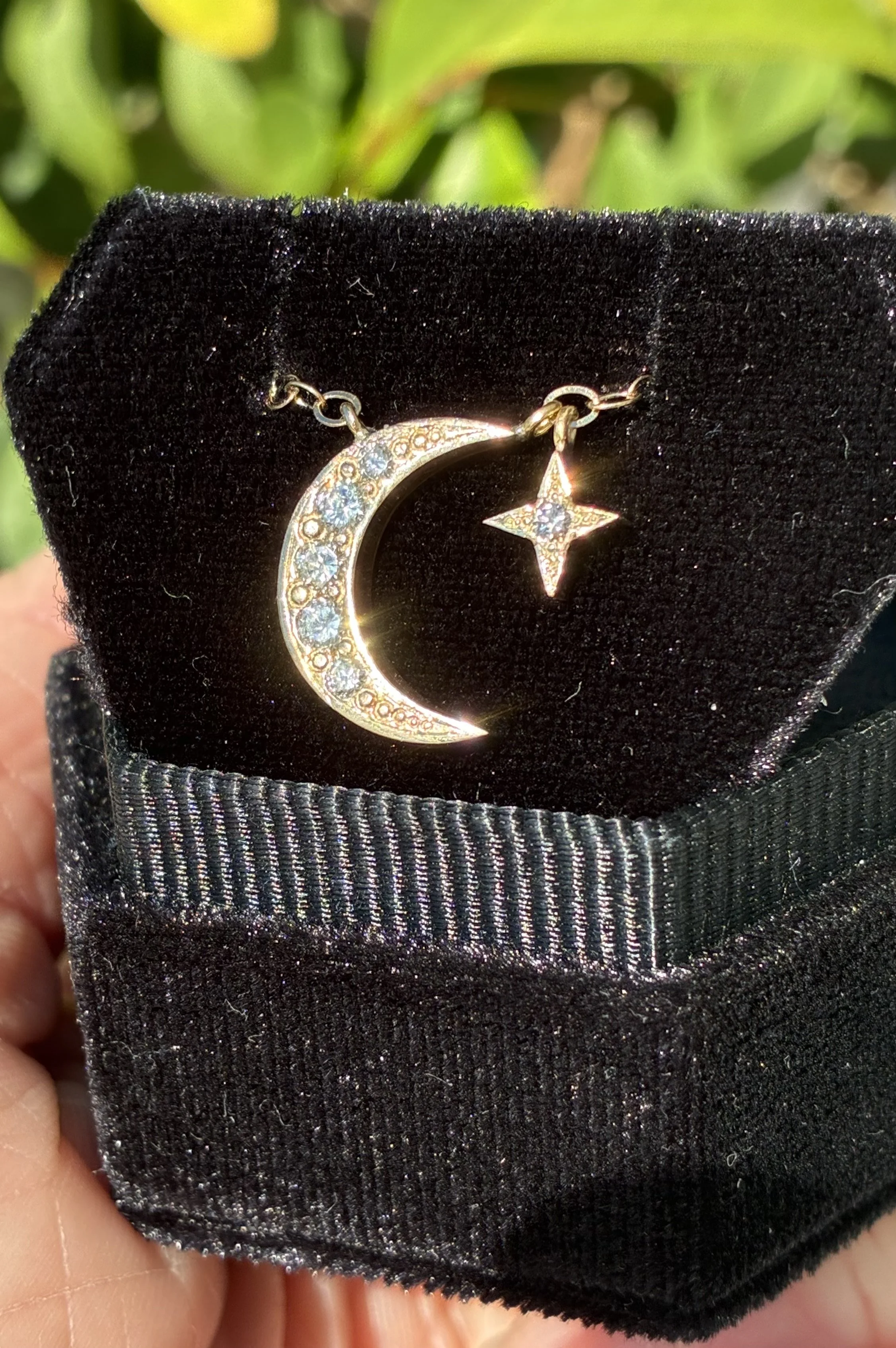 14K gold waning moon and North Star necklace with diamonds, made using the client’s recycled gold and diamonds.