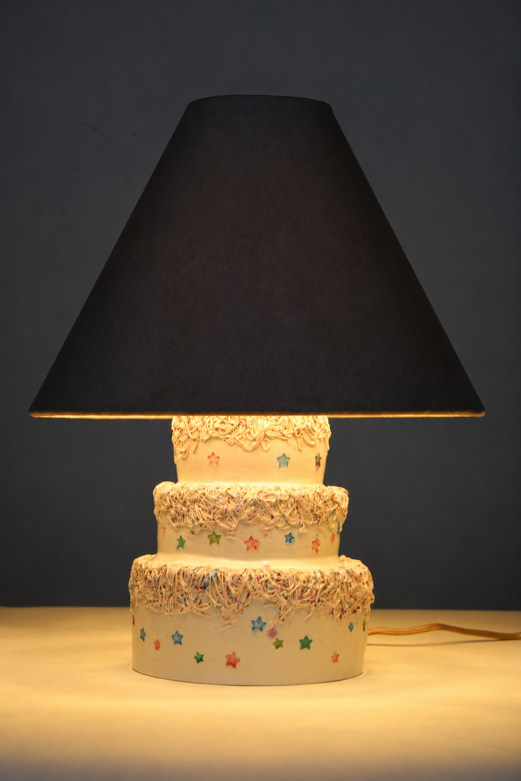 Whimsical Cake-Tier Lamp Glow.png