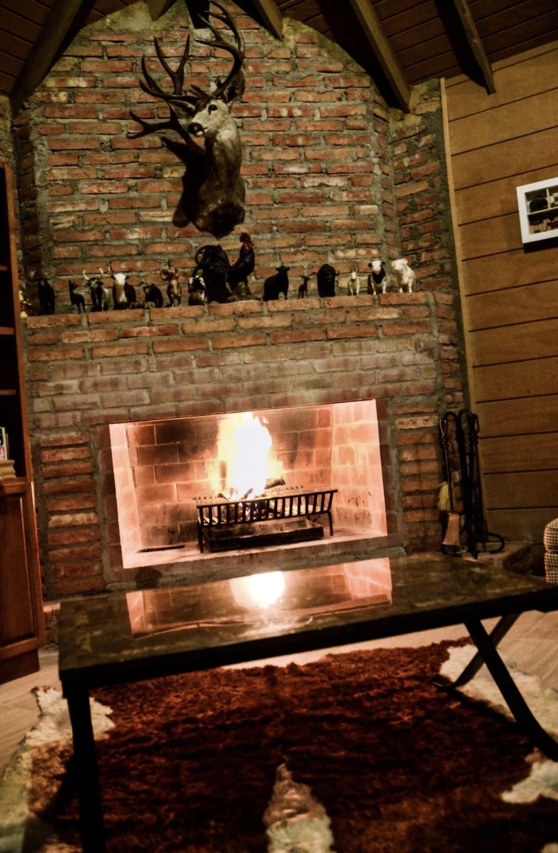 Indoor fireplace and living area at Baja Vineyard Lodge, a cozy space for relaxing.