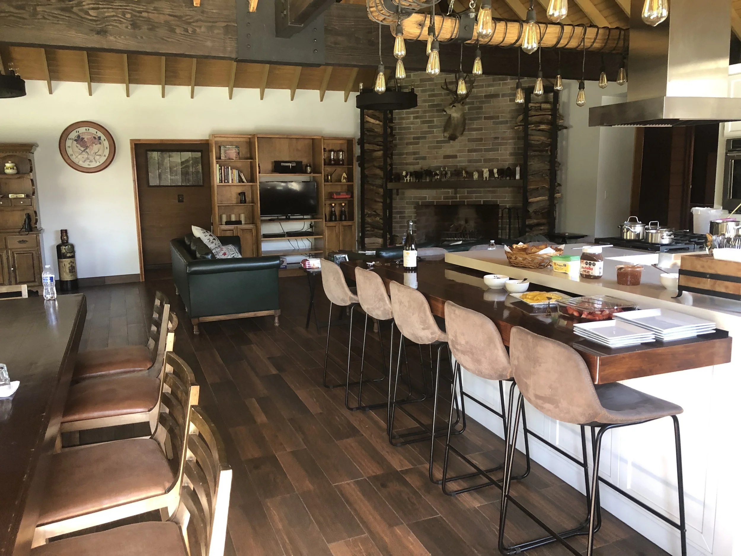 Spacious open-plan kitchen with a large island and seating at Baja Vineyard Lodge.