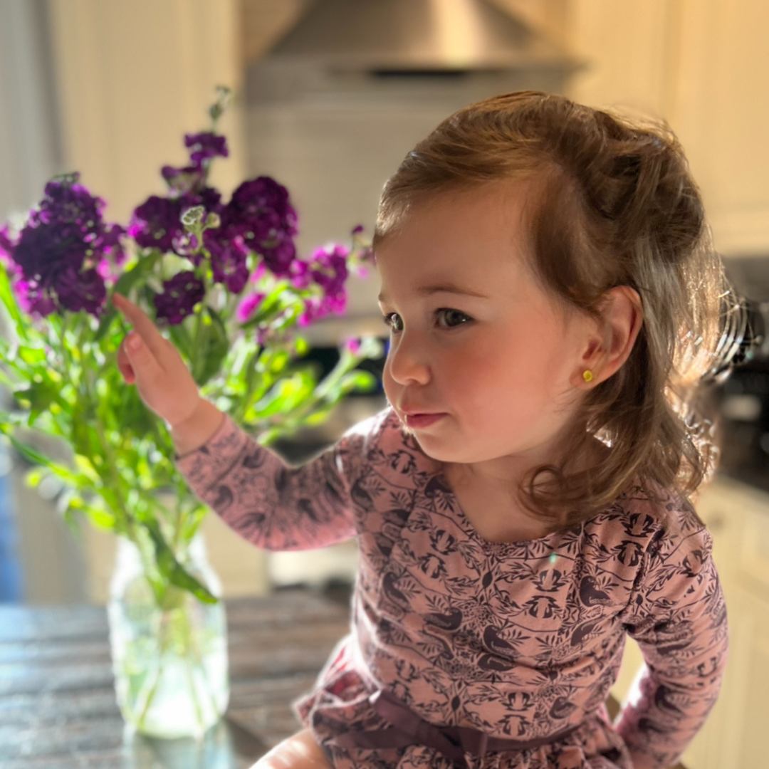 young girl with pierced ears