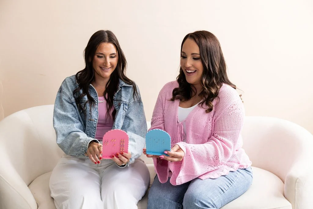 nurse and ear pierces sitting on couch looking at earrings