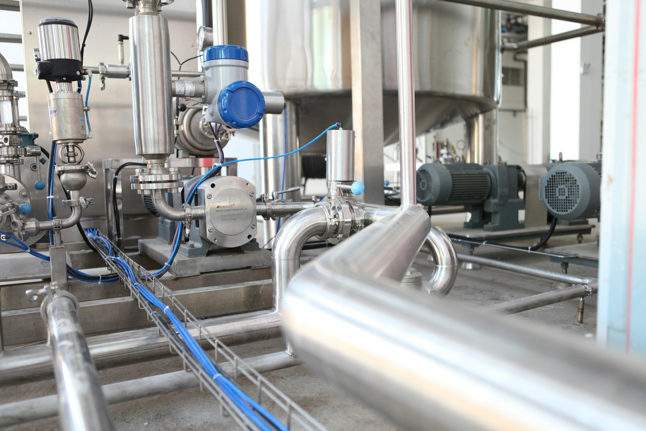 Stainless process piping, instruments and pumps in an industrial facility