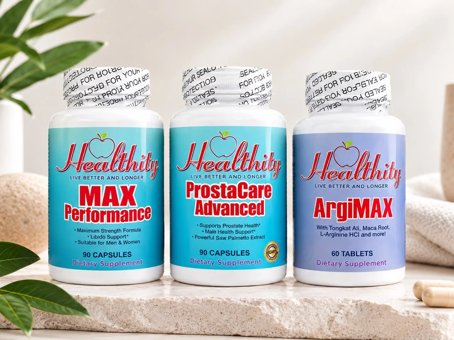 Tres frascos de suplementos dietéticos de la marca Healthity en un fondo claro, con hojas verdes a la izquierda y cápsulas en la esquina inferior derecha.