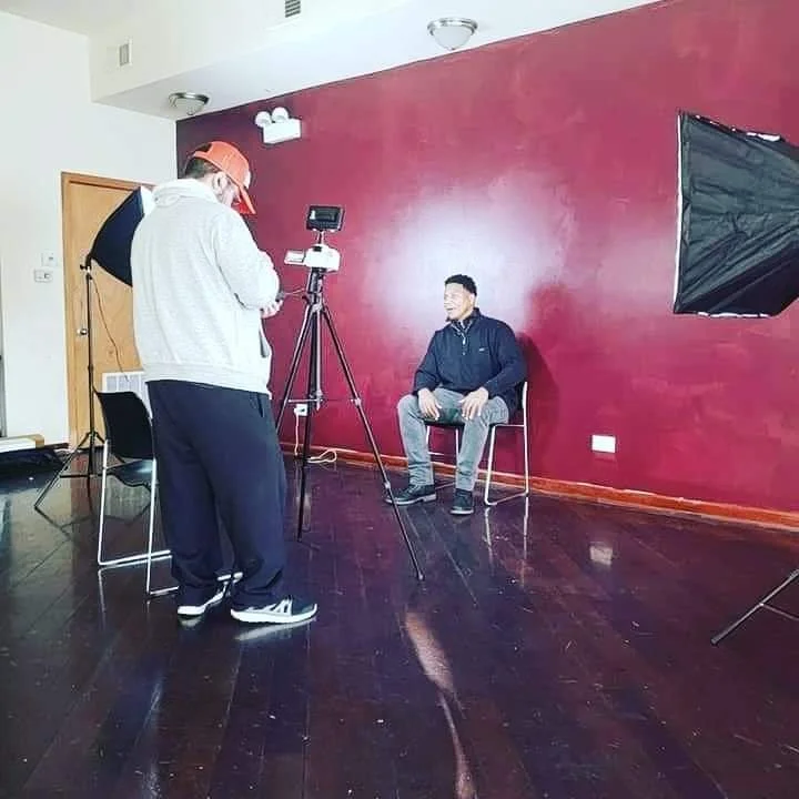 Photographer capturing a male actor during a professional creative arts photography session at FAM Entertainment Theater Company.