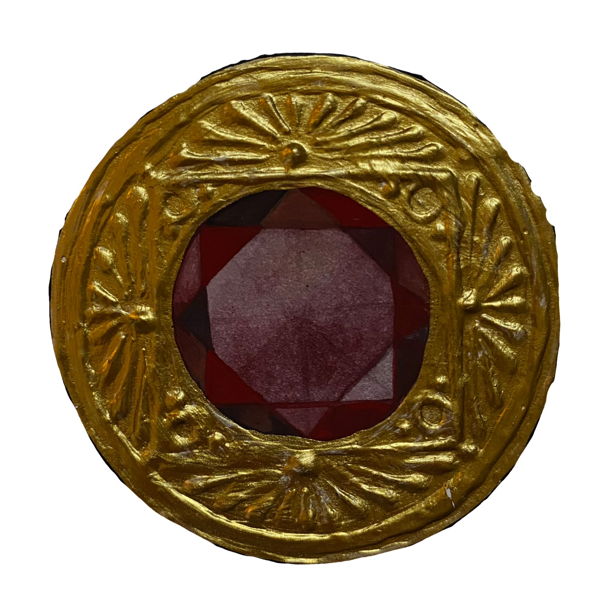 Close-up of a golden ornate frame surrounding a red geometric shaped gemstone.