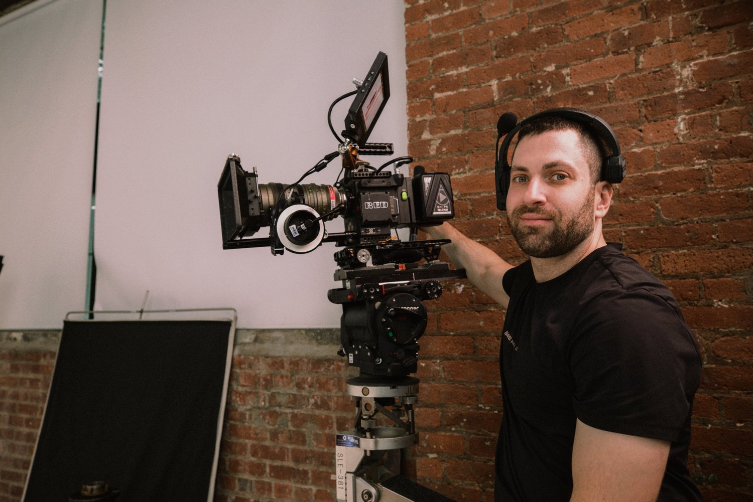 Ari Miller on set operating a cinema camera