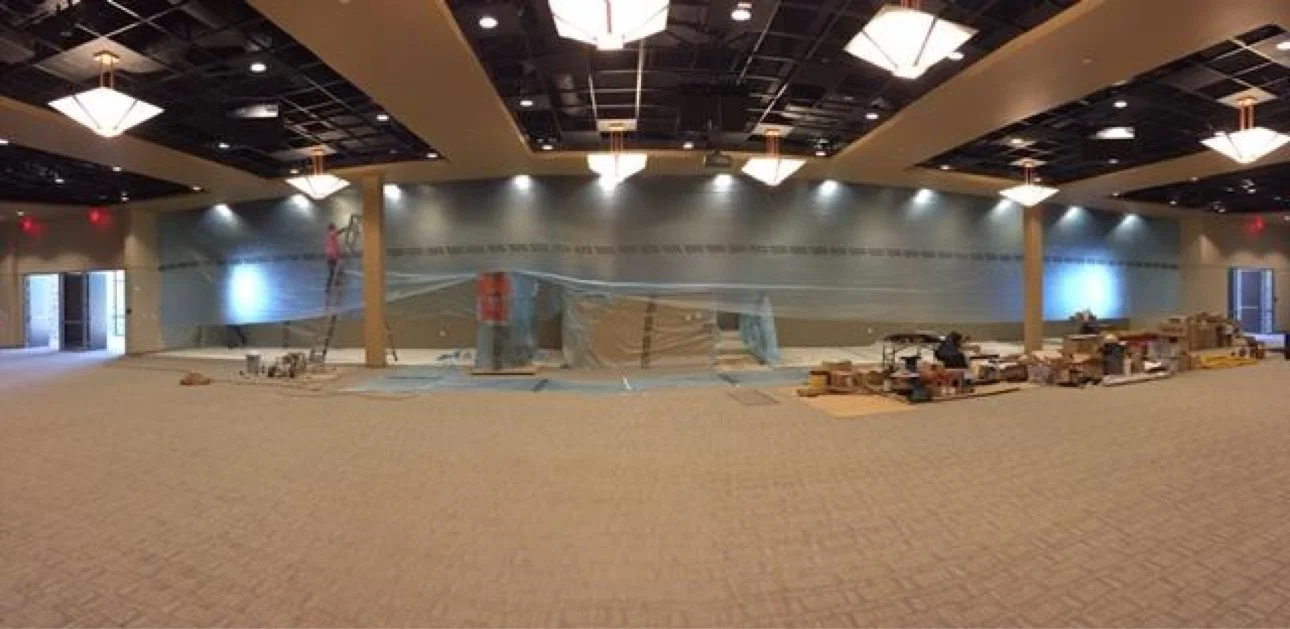 Commercial interior renovation in progress with protective sheeting