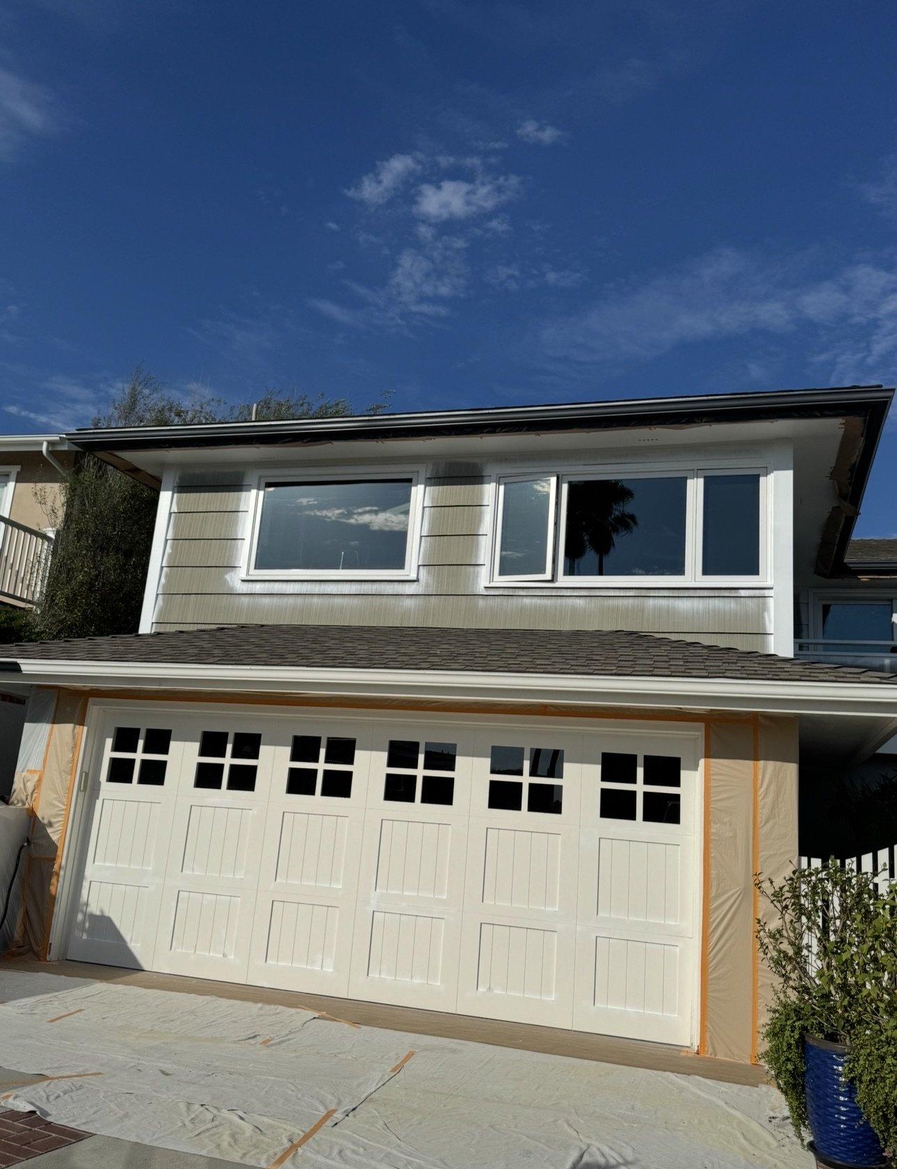 Exterior Painting — Rancho Mission Viejo — Faux-wood stain in progress on garage beam