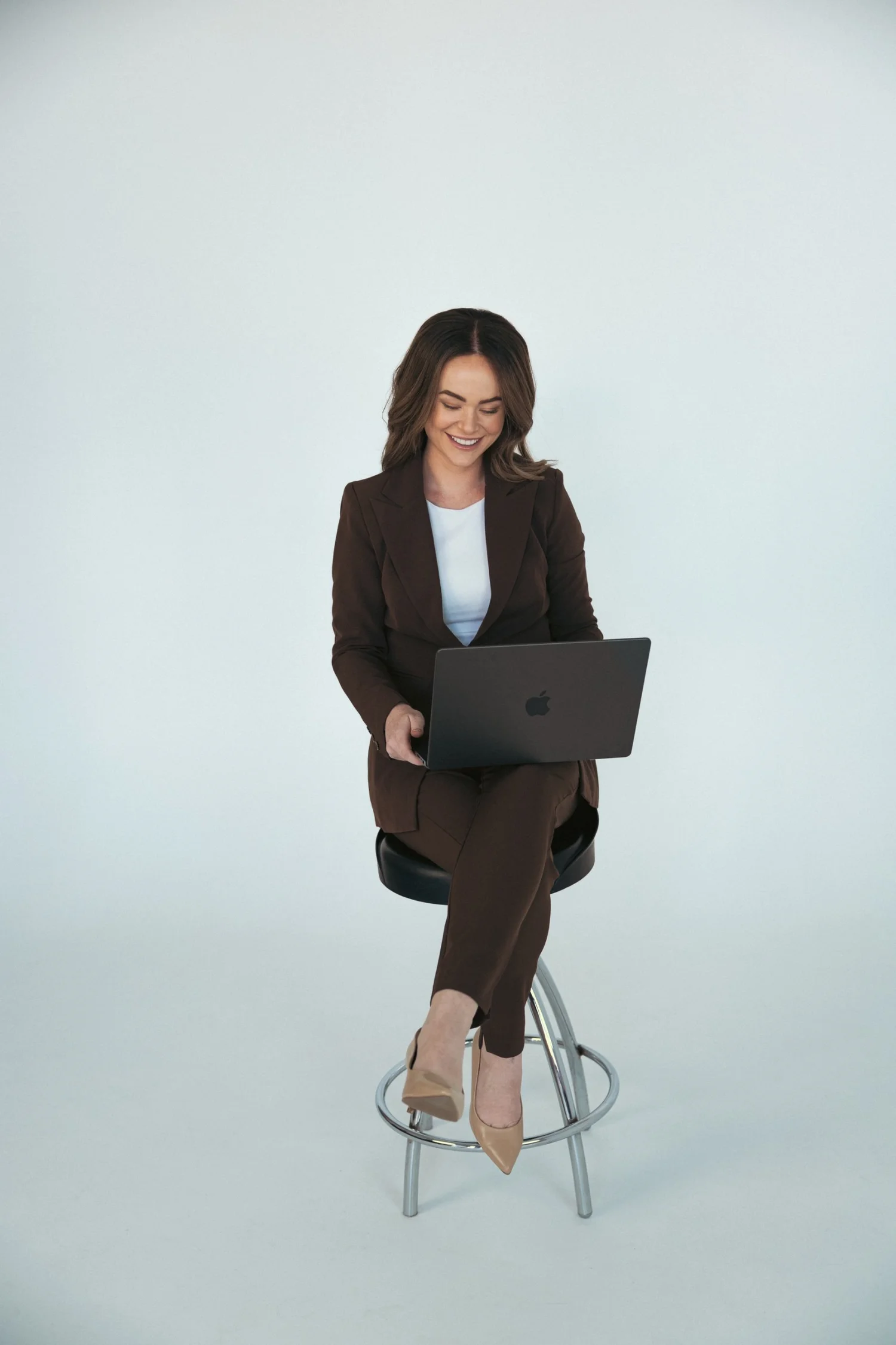 Tahlia Hadfield, founder of Just Thynk, working on her laptop