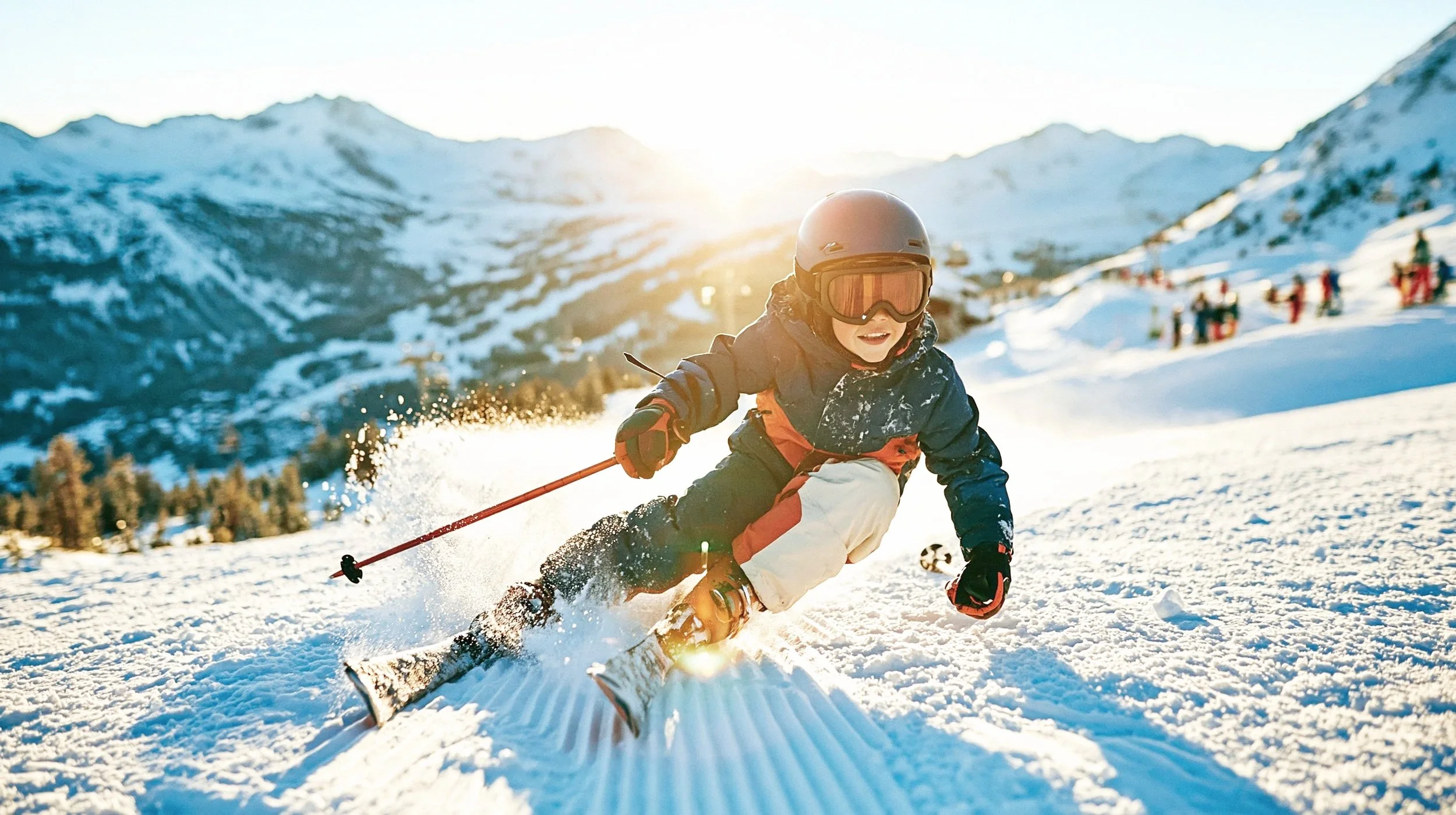 Child carving a turn on a groomed piste in a navy and orange ski jacket and cream salopettes, snow spray and low alpine sun — kidswear skiwear campaign, action, winter. AI-generated image.