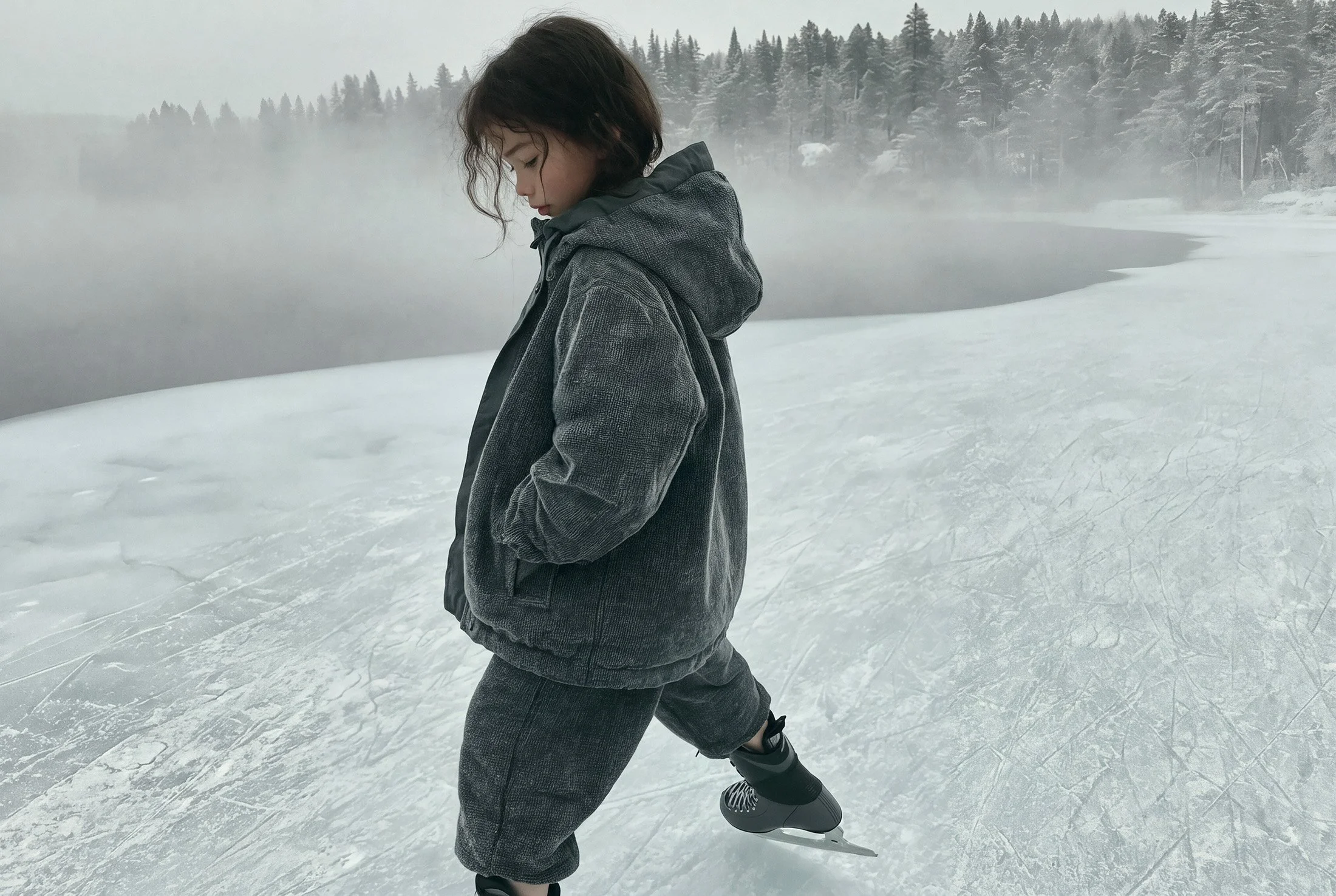 Child in skates on the frozen surface of a lake in winter mist. AI-generated image.