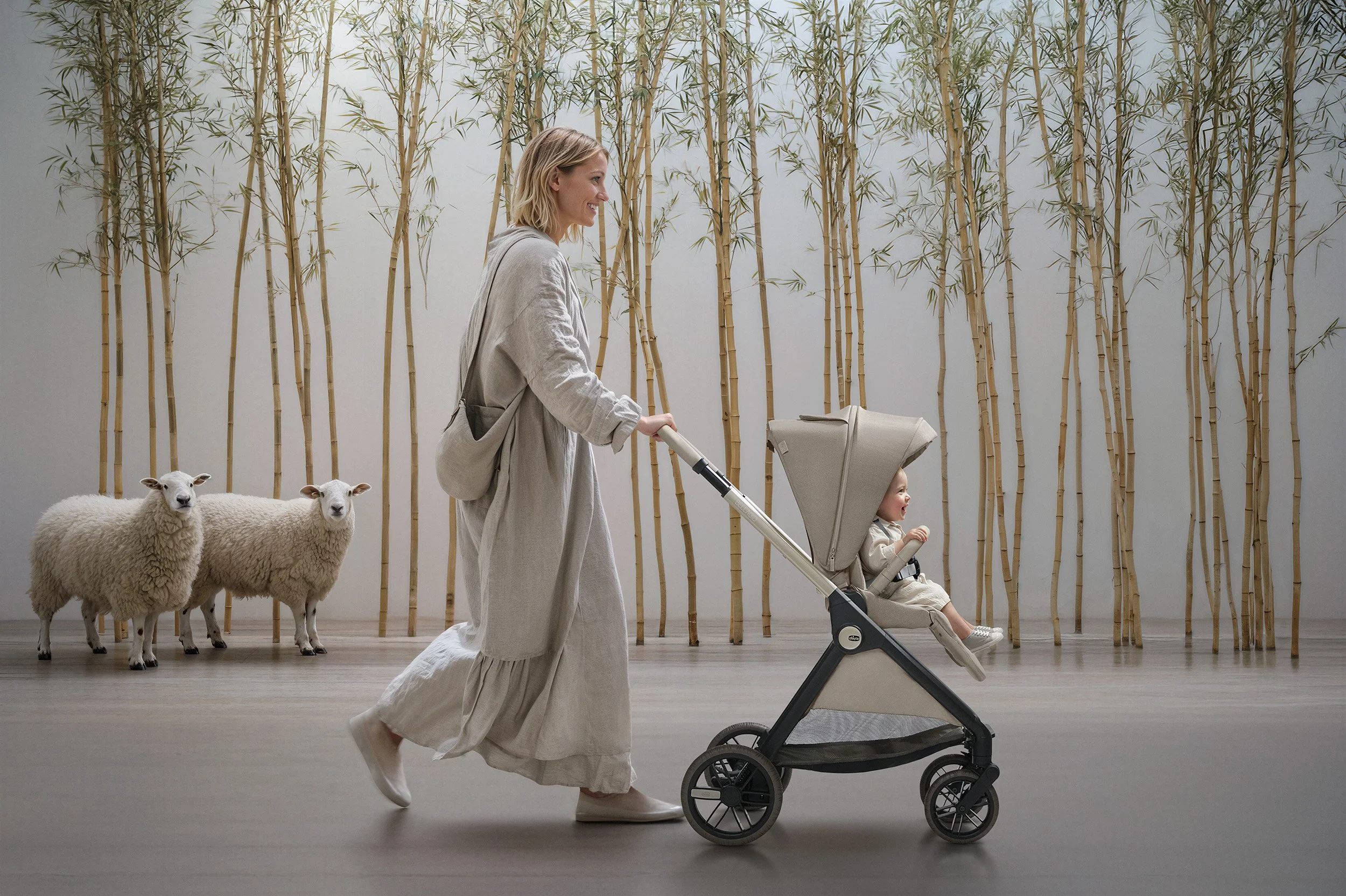 Woman pushing a Chicco Bellagio stroller among sheep in a studio bambù set. AI-generated image.