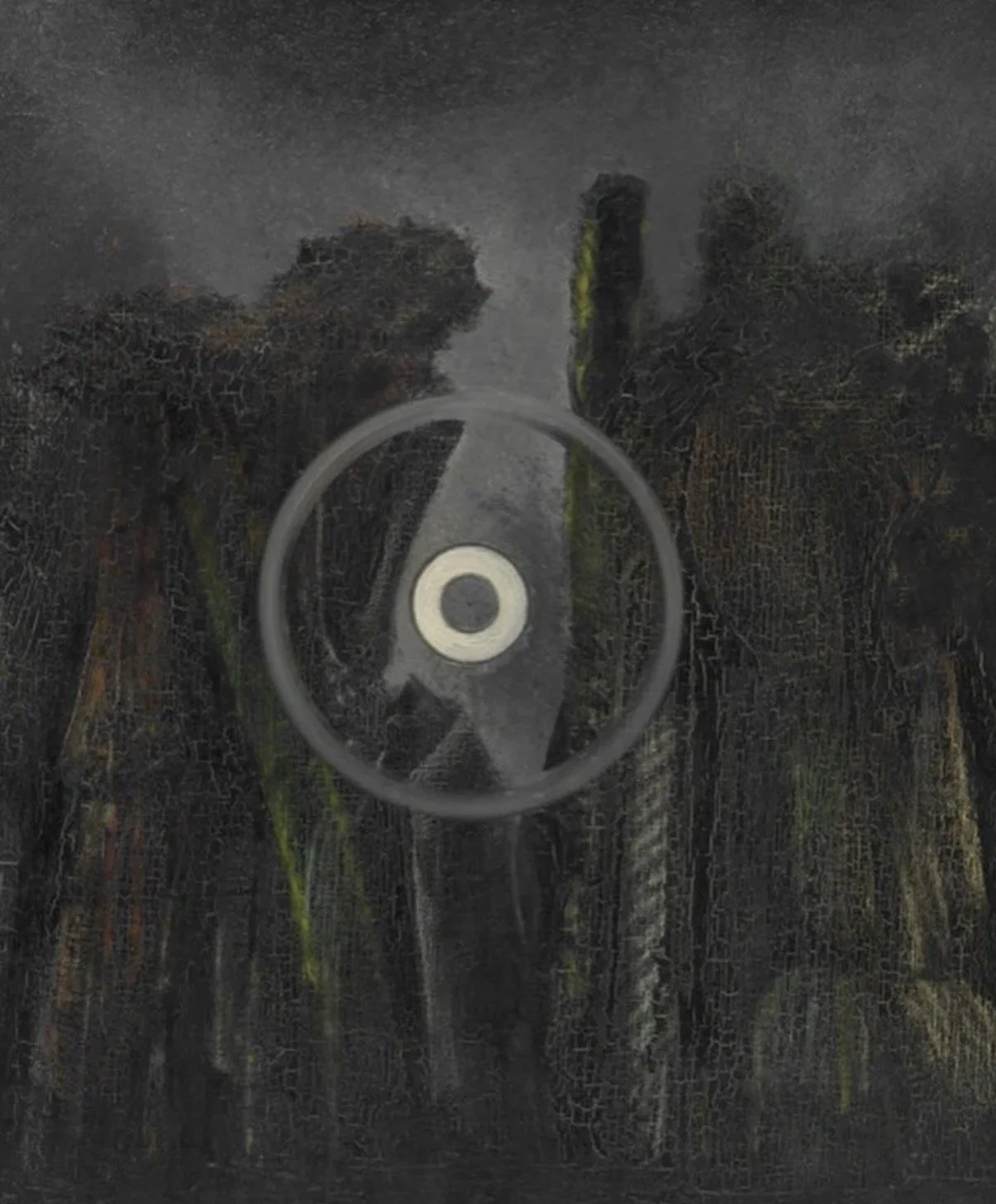 Close-up of a black surface with reflections showing two people, and a circular metallic object in the center.