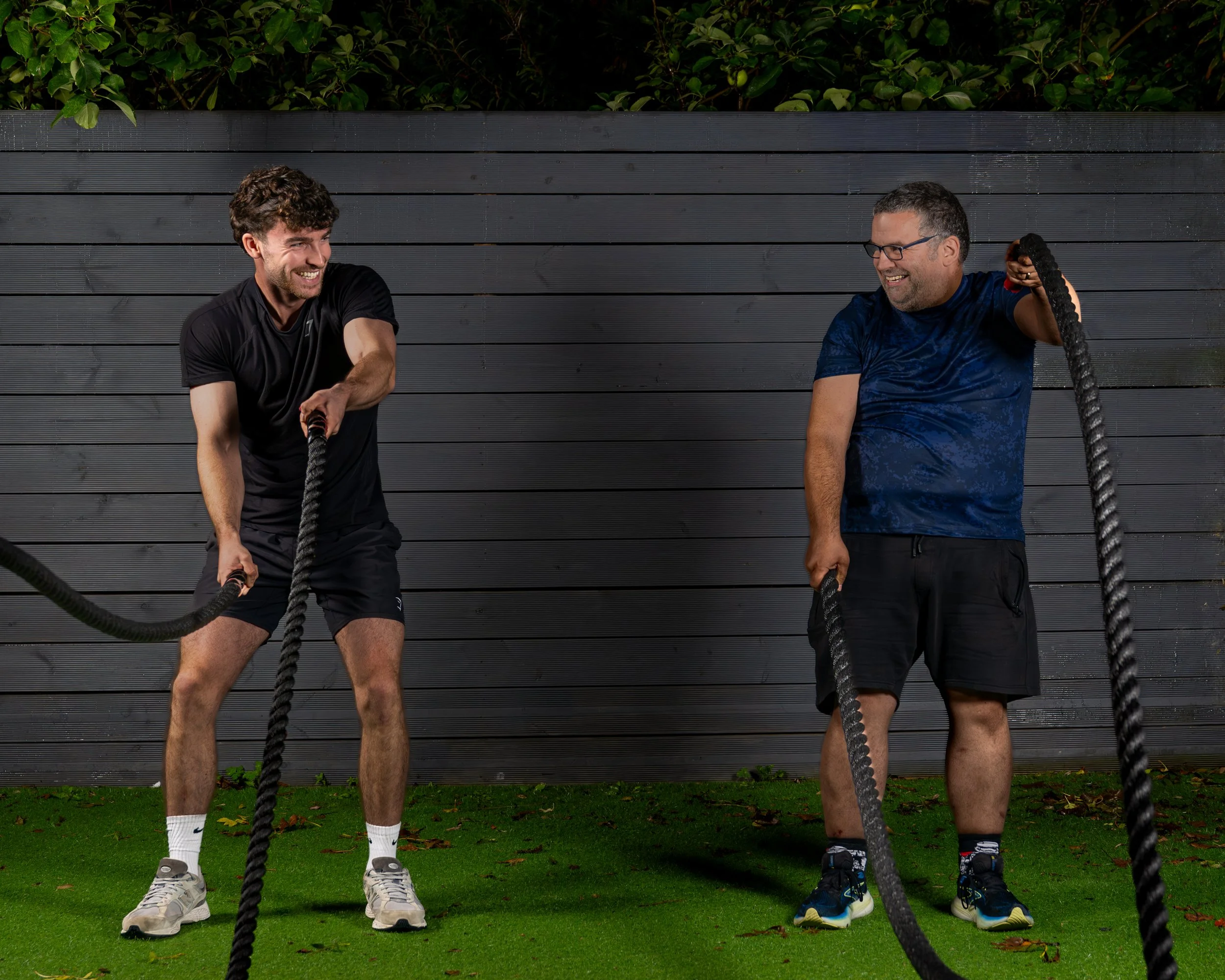 Personal Trainer and client smiling during exercise