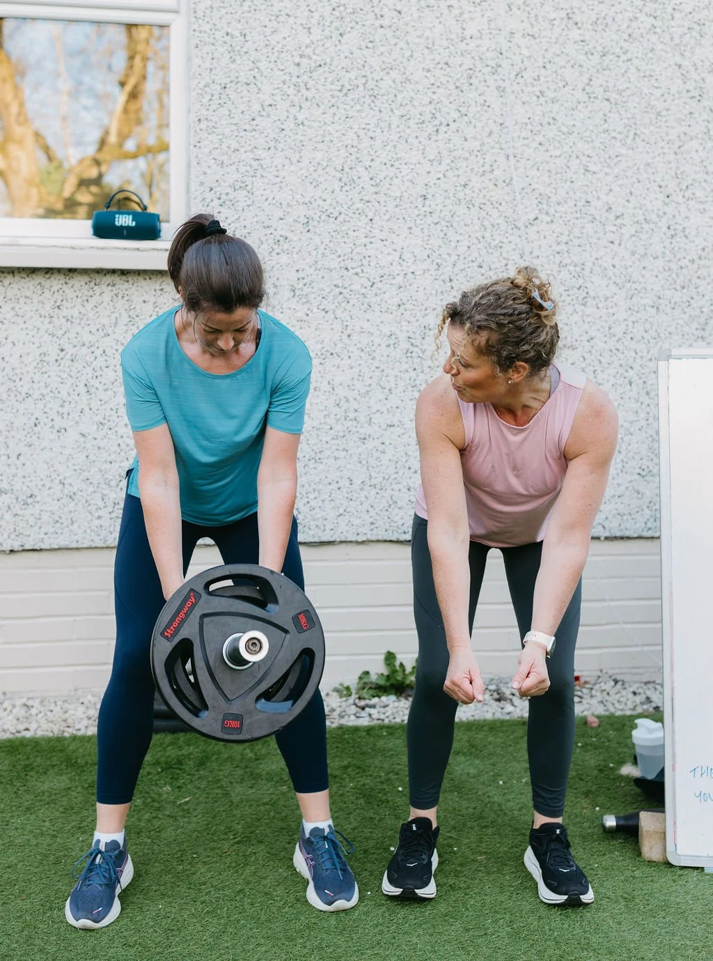 Personal Trainer Sandra helping a client