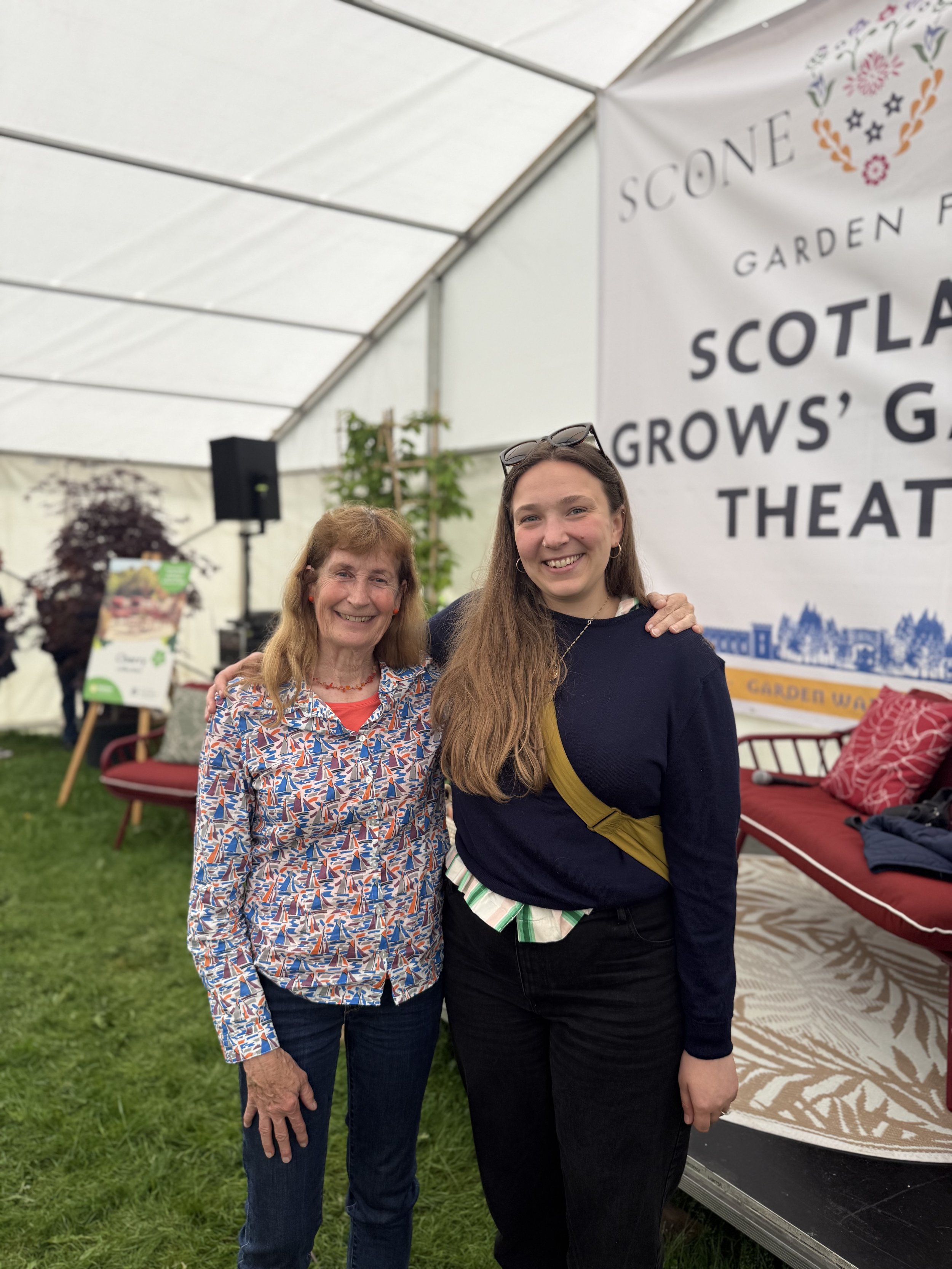 Carole Baxter and Sofie Brøgger smiling, inside a tent at a Scotland Grows event at Scone Palace Garden Fair.