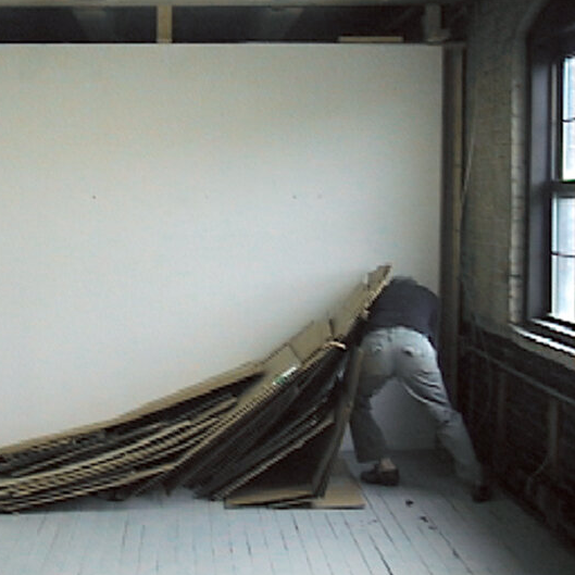   Cardboard Actions,  video still, 2006, three-channel video within installation with cardboard and wire, dimensions variable 