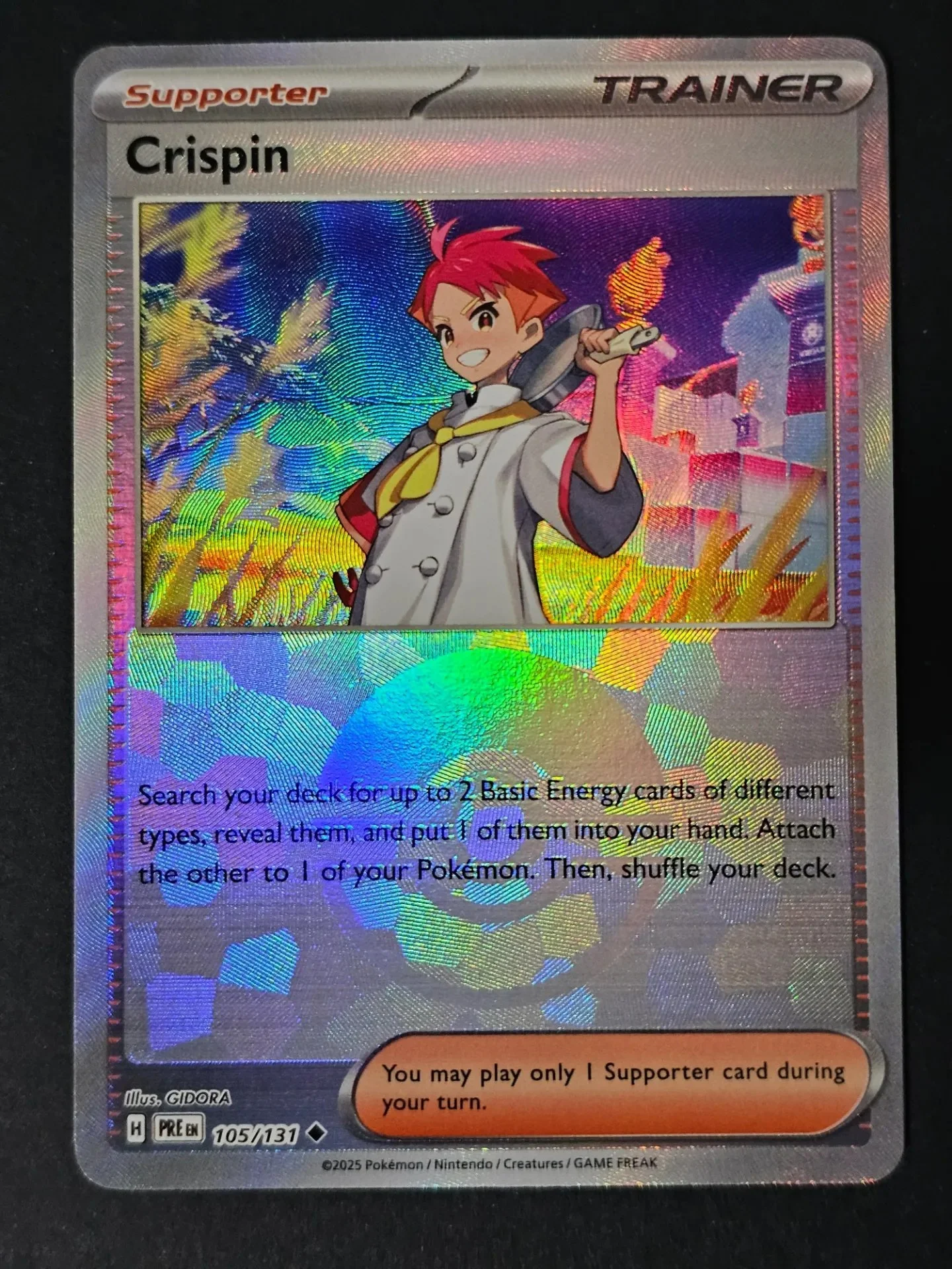 Crispin 105/131 - Poke Ball Pokemon Prismatic Evolutions