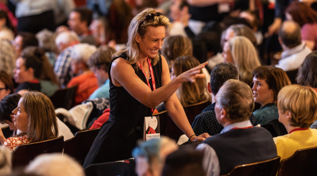 Anna at TEDx Portsmouth in the audience smiling