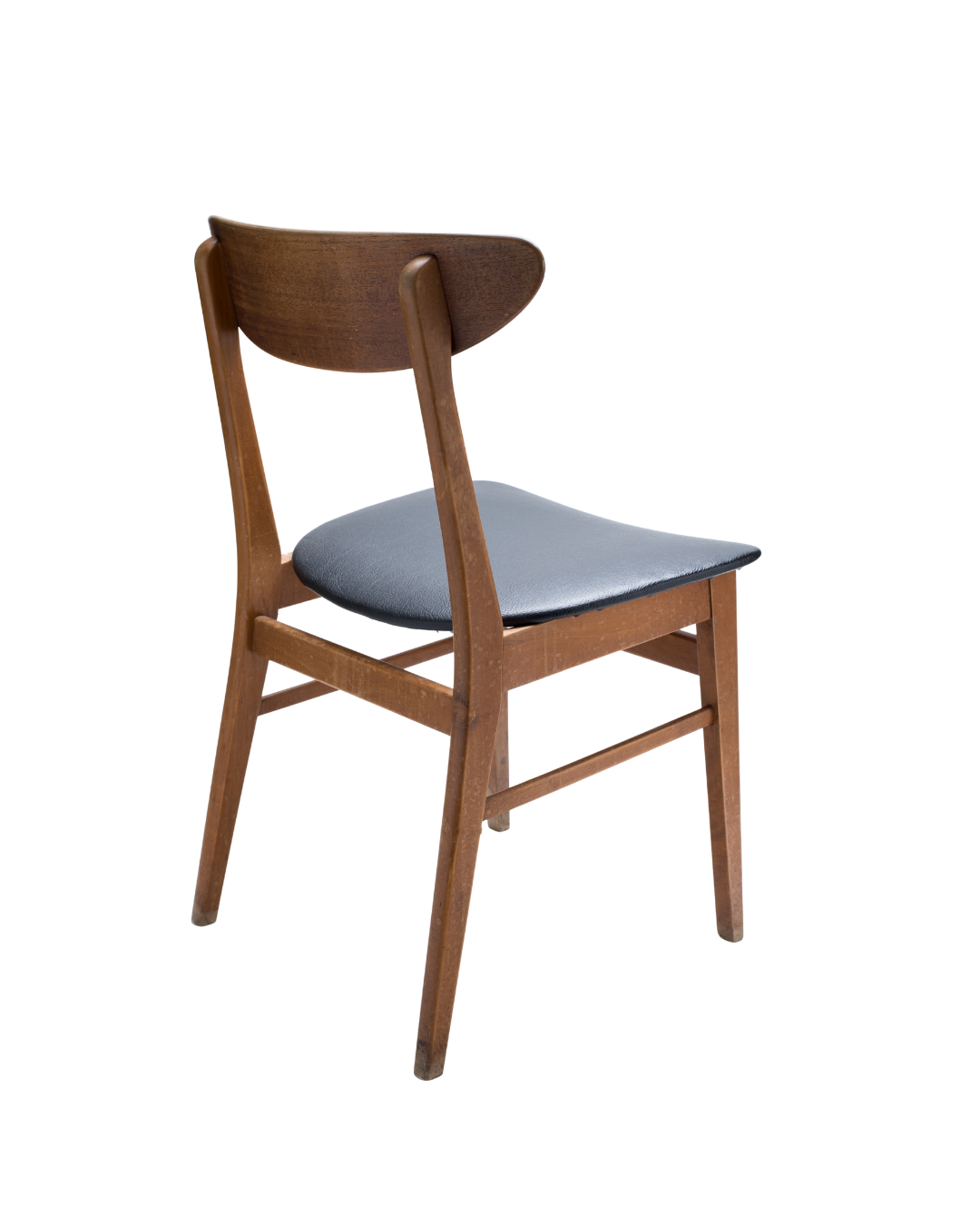 Wooden chair with a dark gray seat cushion, photographed from a slight angle.