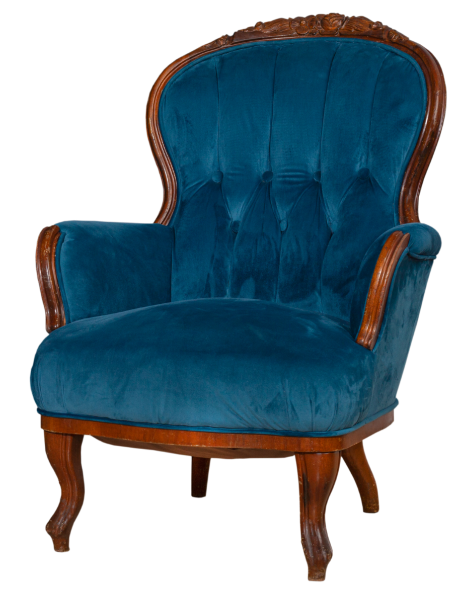 A vintage-style armchair with a wooden frame and blue velvet upholstery.