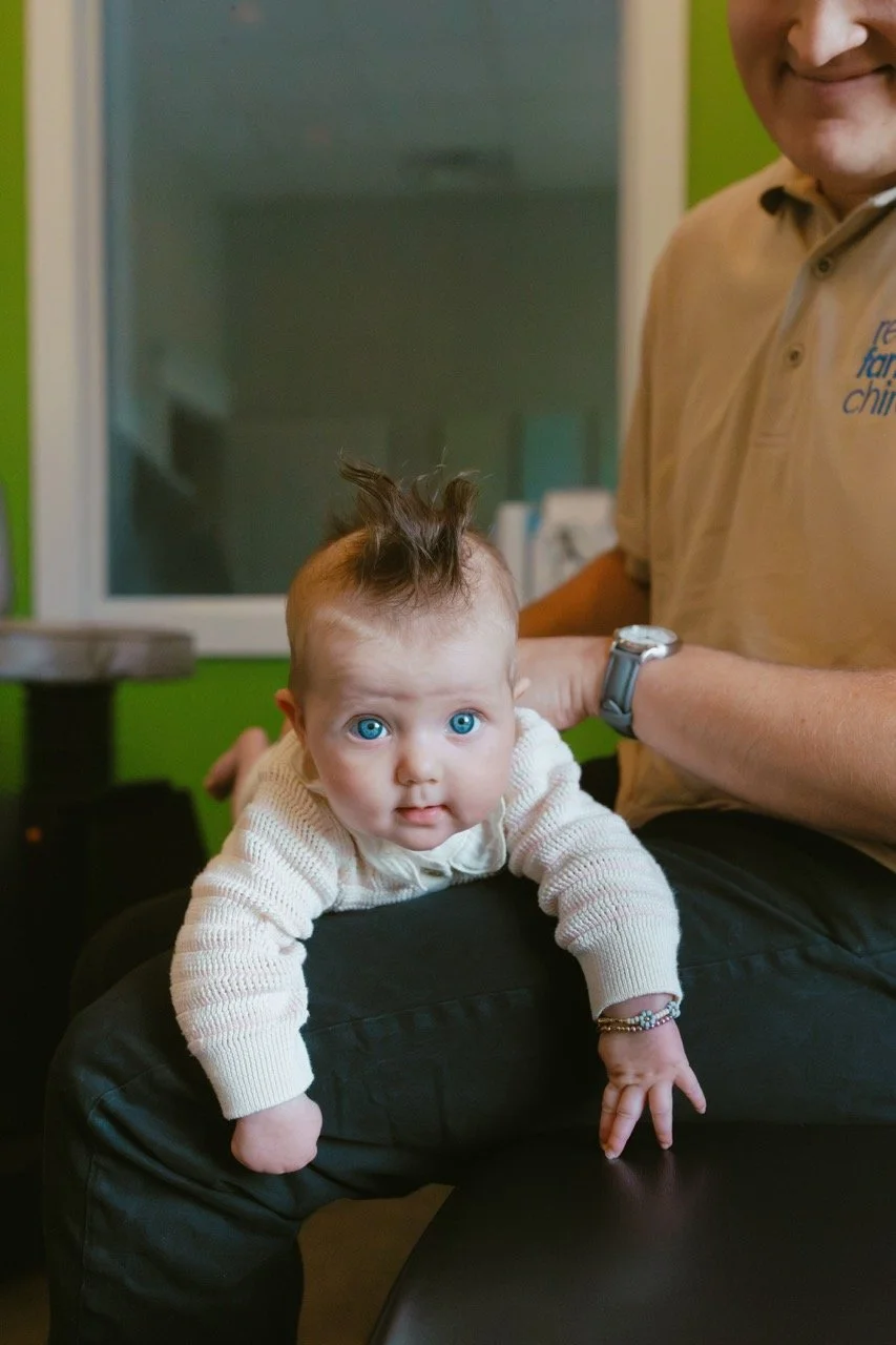 Dr. Cameron Rennie providing gentle infant chiropractic care for torticollis and feeding tension in Spanish Fork, Utah