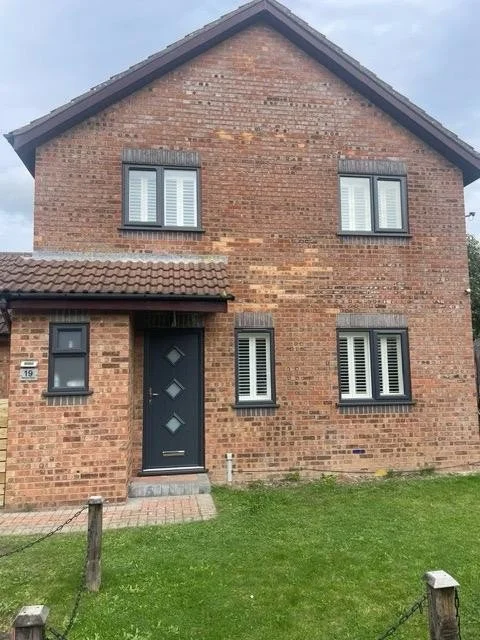 anthracite grey windows and door red brick house clevedon