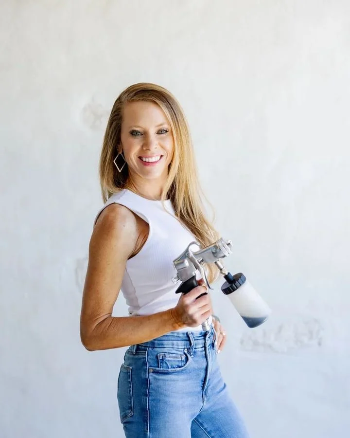 Kendell with her spray tan equipment