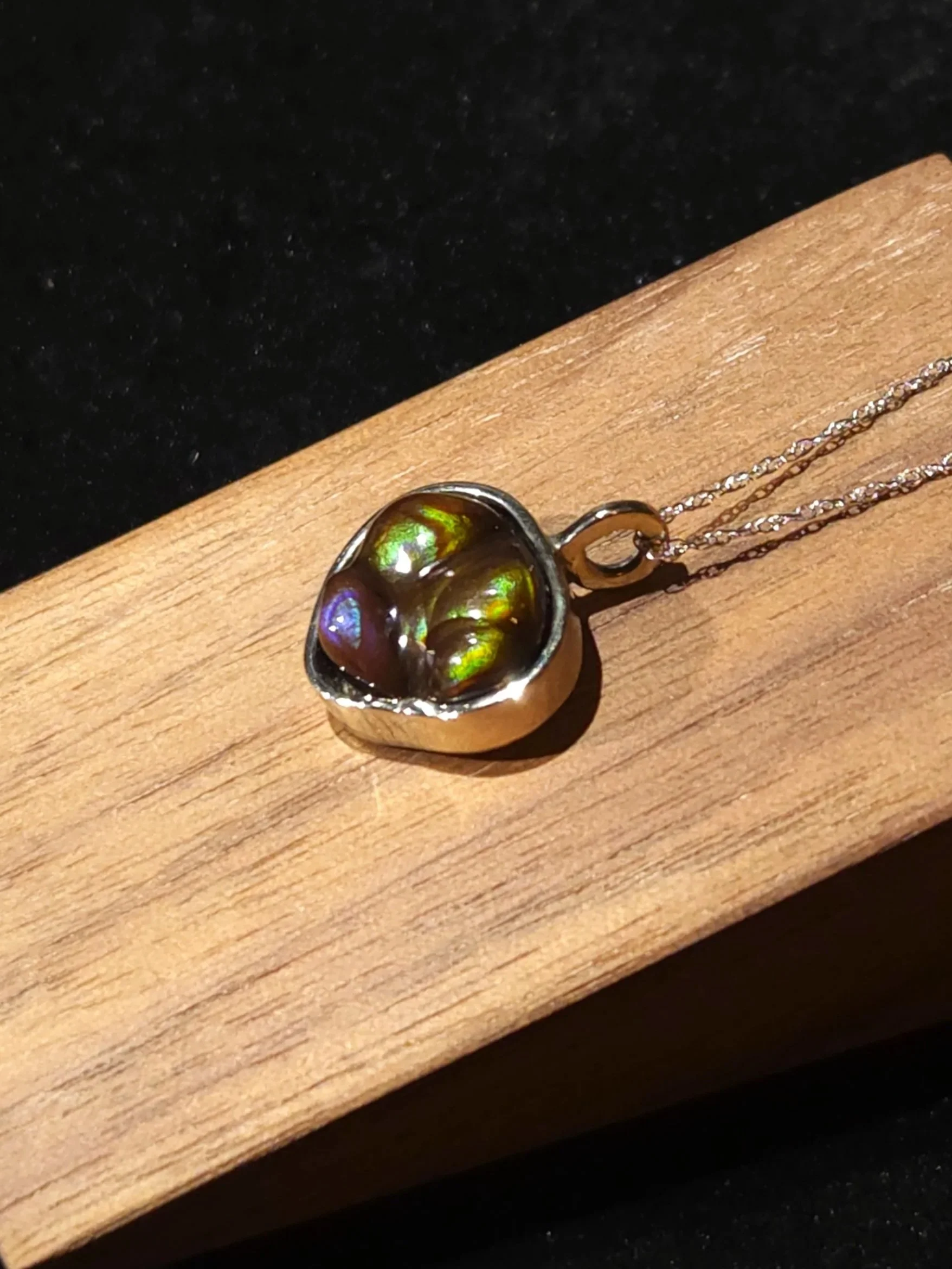 Handcrafted 14k white gold necklace featuring a stunning green and blue fire agate