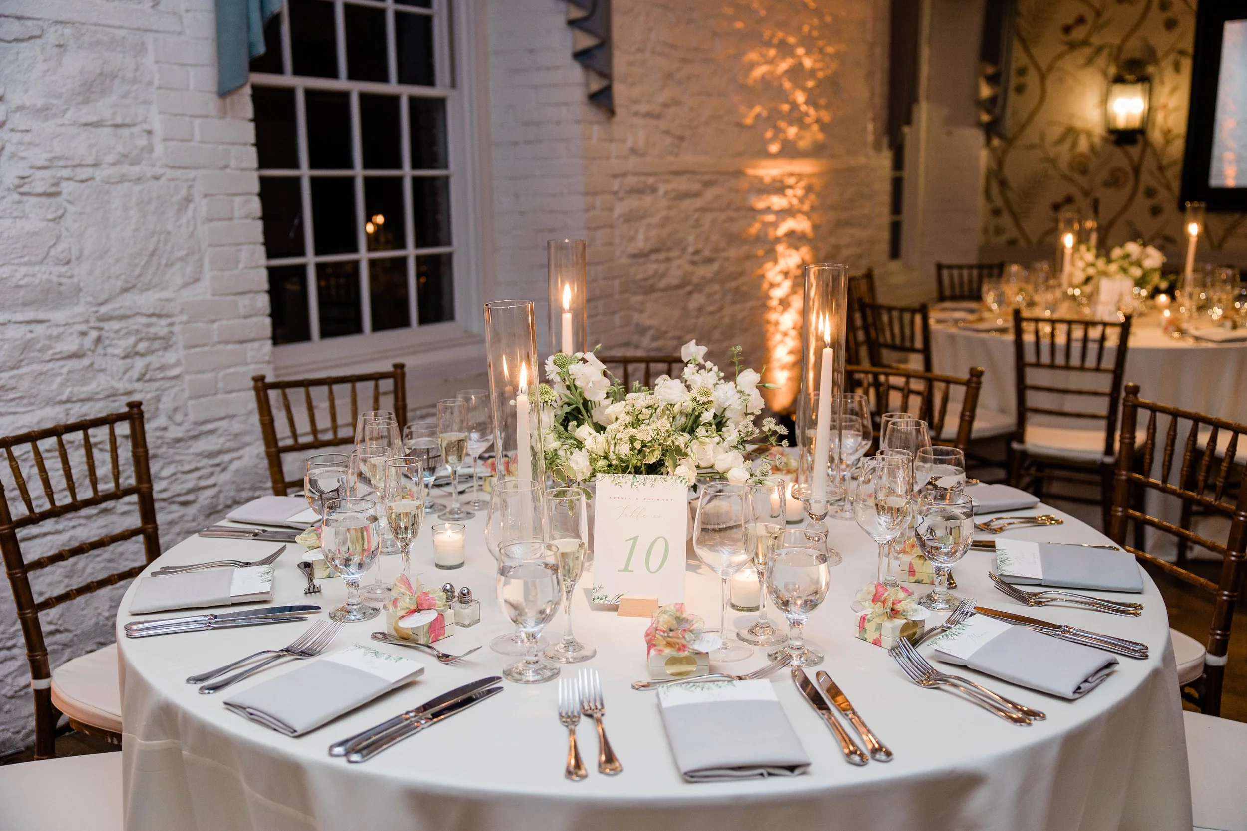 Reception Centerpiece with Tapered Candles and Votives at New York Botanical Stonemill