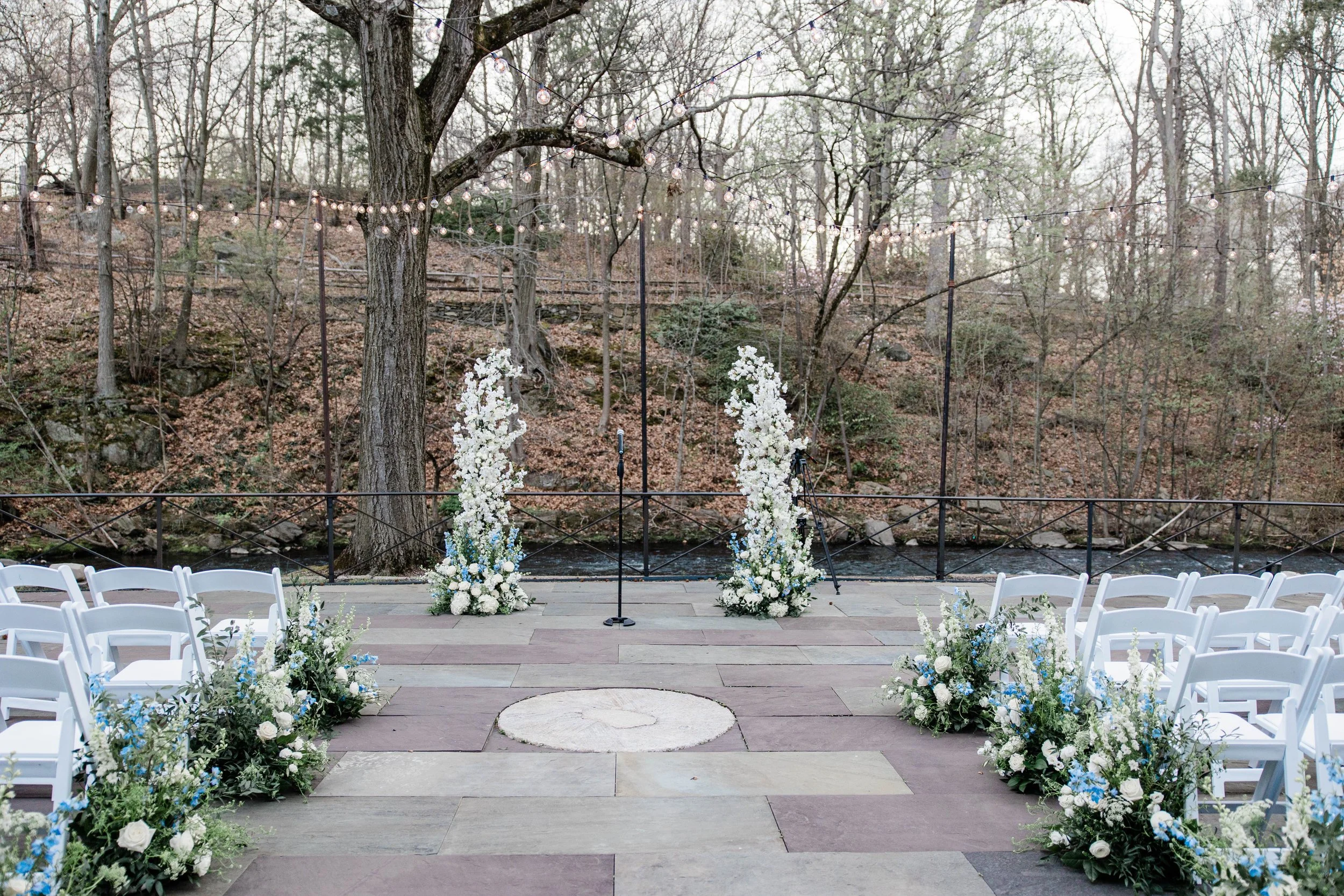 Ceremony shot down the aisle, Open broken Ceremony Arch, White Cherry Blossoms, String Lights, Ceremony Inspiration