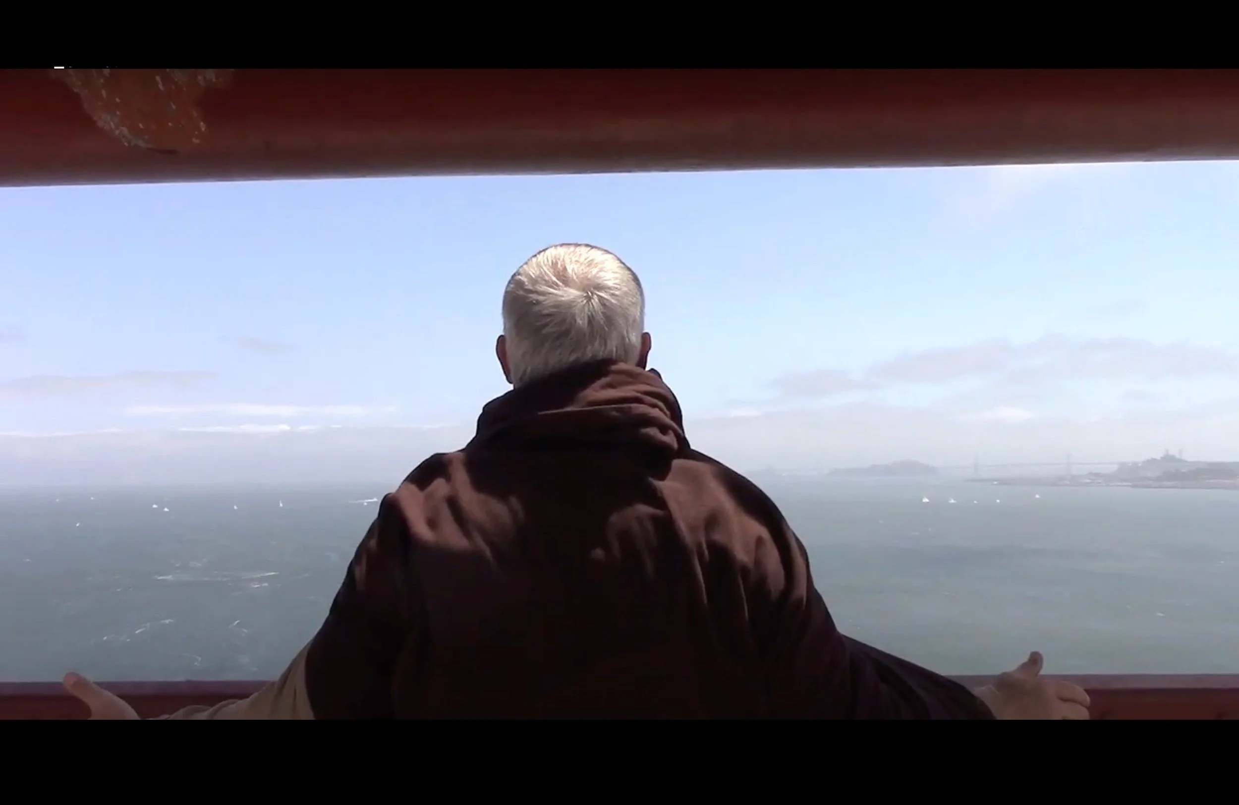 CON TE PARTIRO PROCESSIONAL

How far is an adult son willing to go in a solo public walk to the suicide point of the Golden Gate Bridge in order to meet his father's spirit? Might they finally be able to see one another in death as they are? 