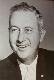Black and white photo of a smiling man